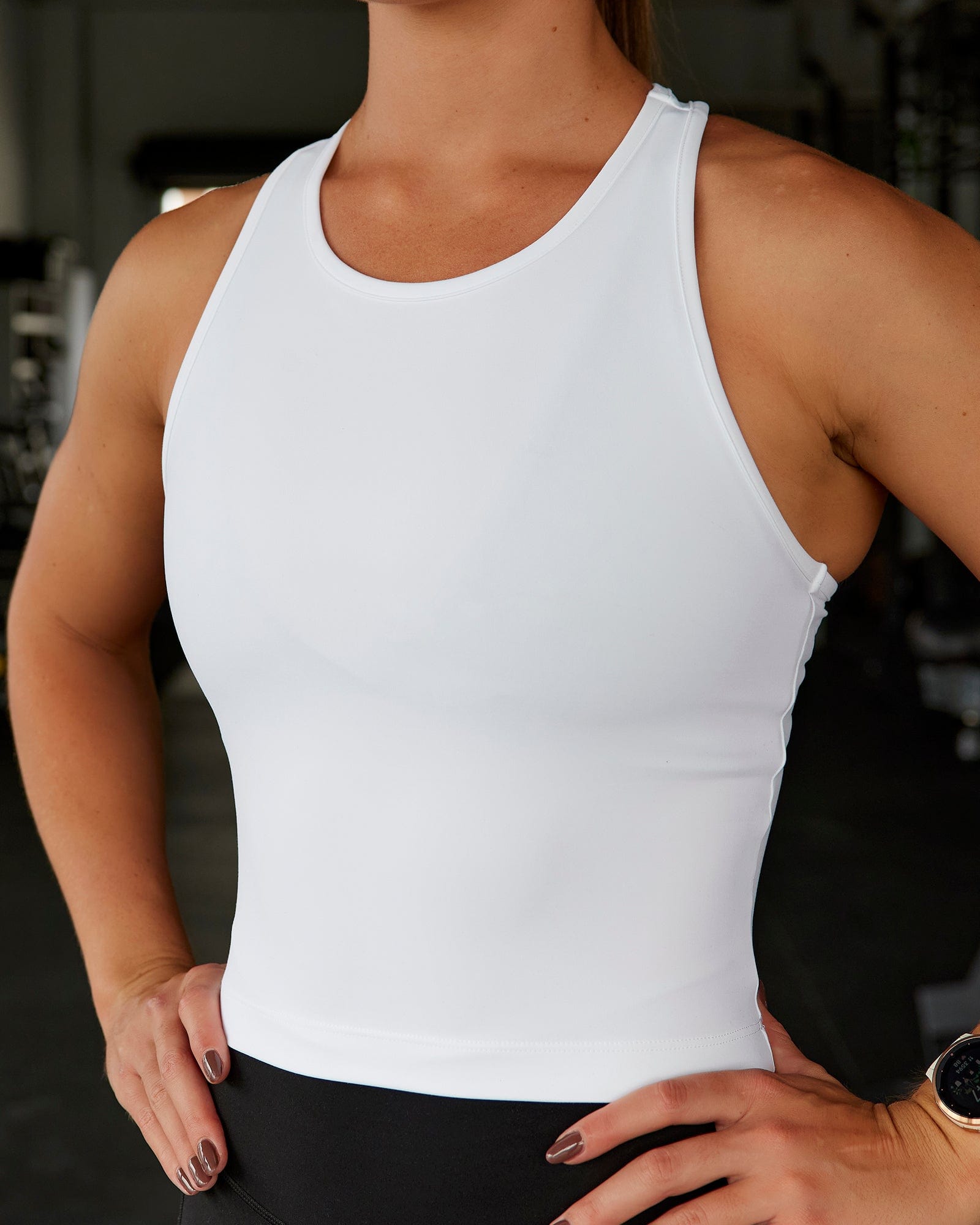 Woman wearing Flow Performance Tank - White