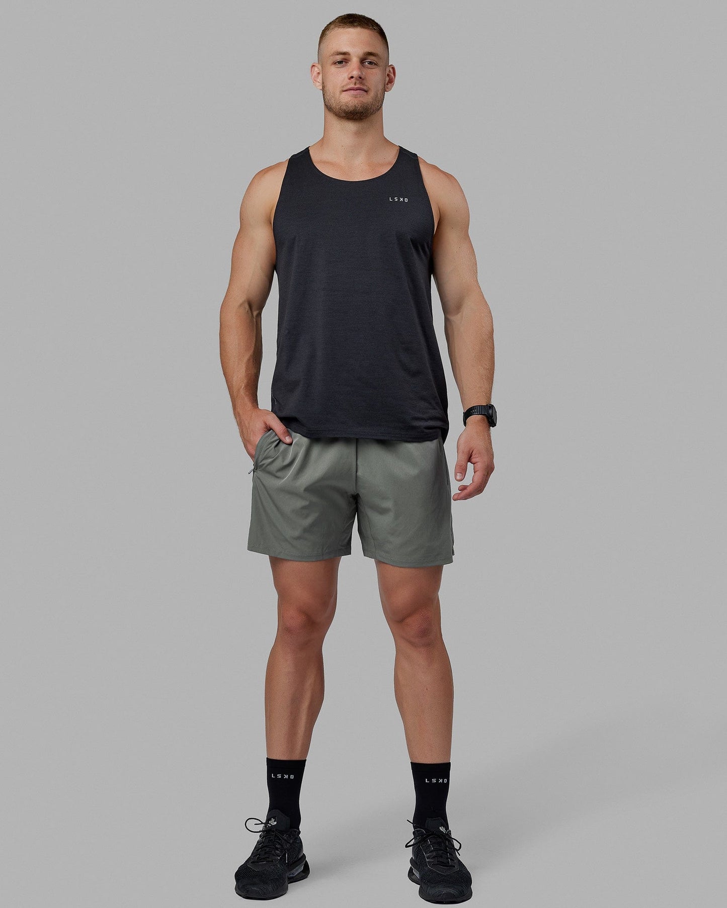 Man wearing Challenger 6" Lined Performance Shorts - Graphite