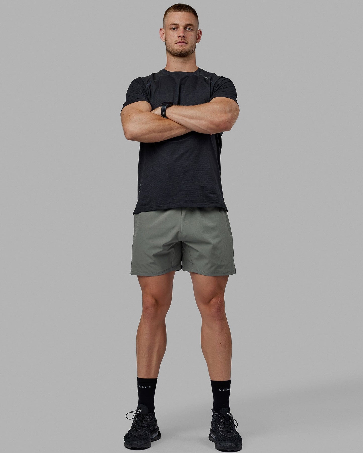 Man wearing Challenger 6" Performance Shorts - Graphite