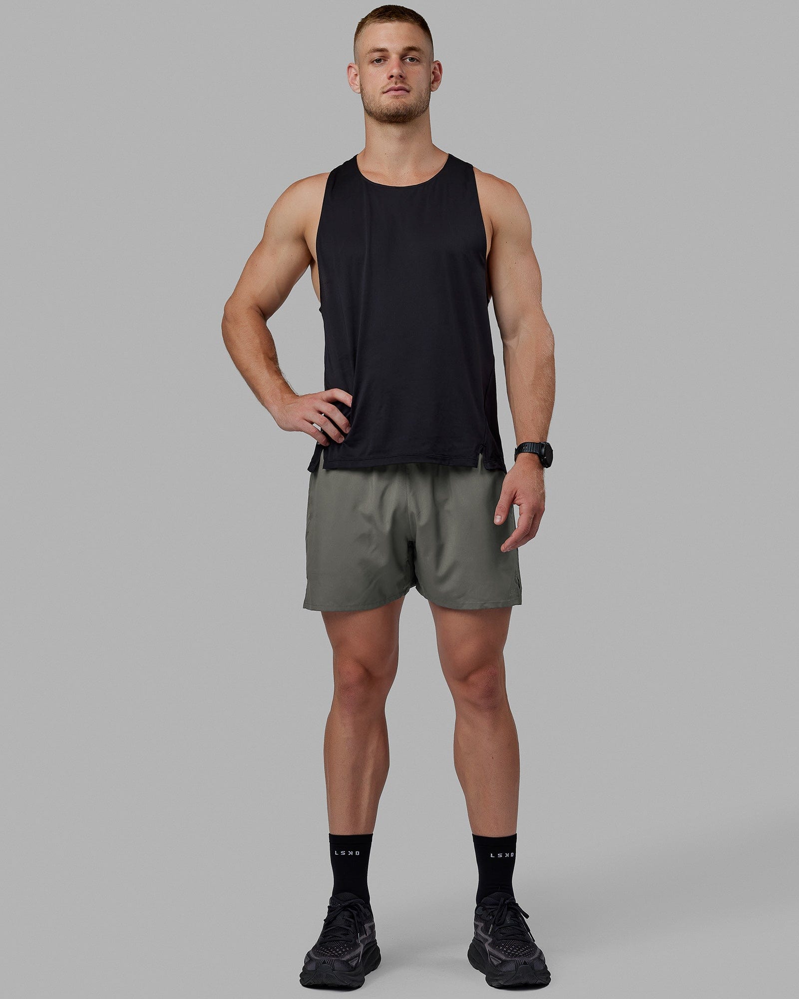 Man wearing Pace 5" Lined Performance Shorts - Graphite-Reflective