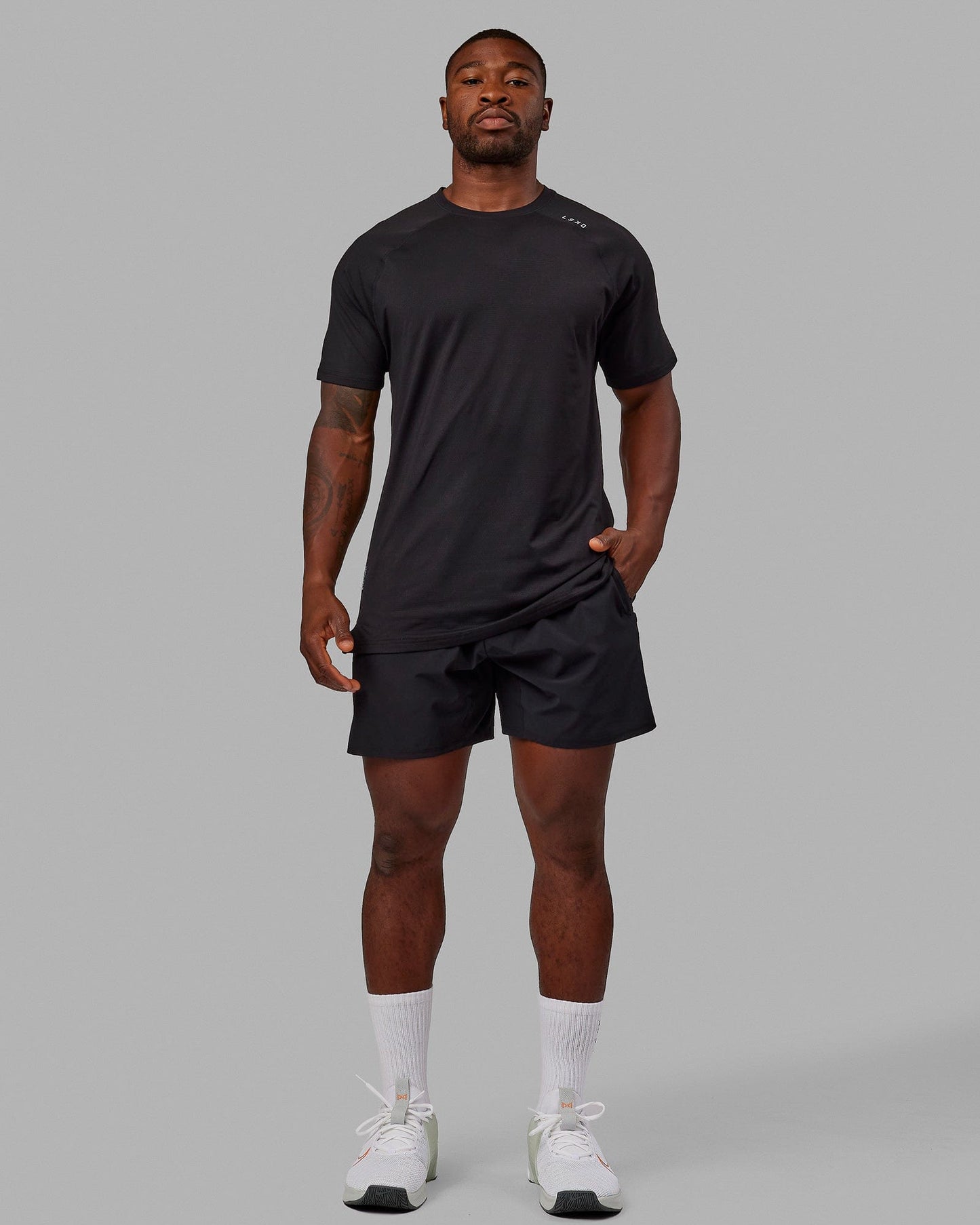 Man wearing Perform VapourFLX Tee - Black-Reflective