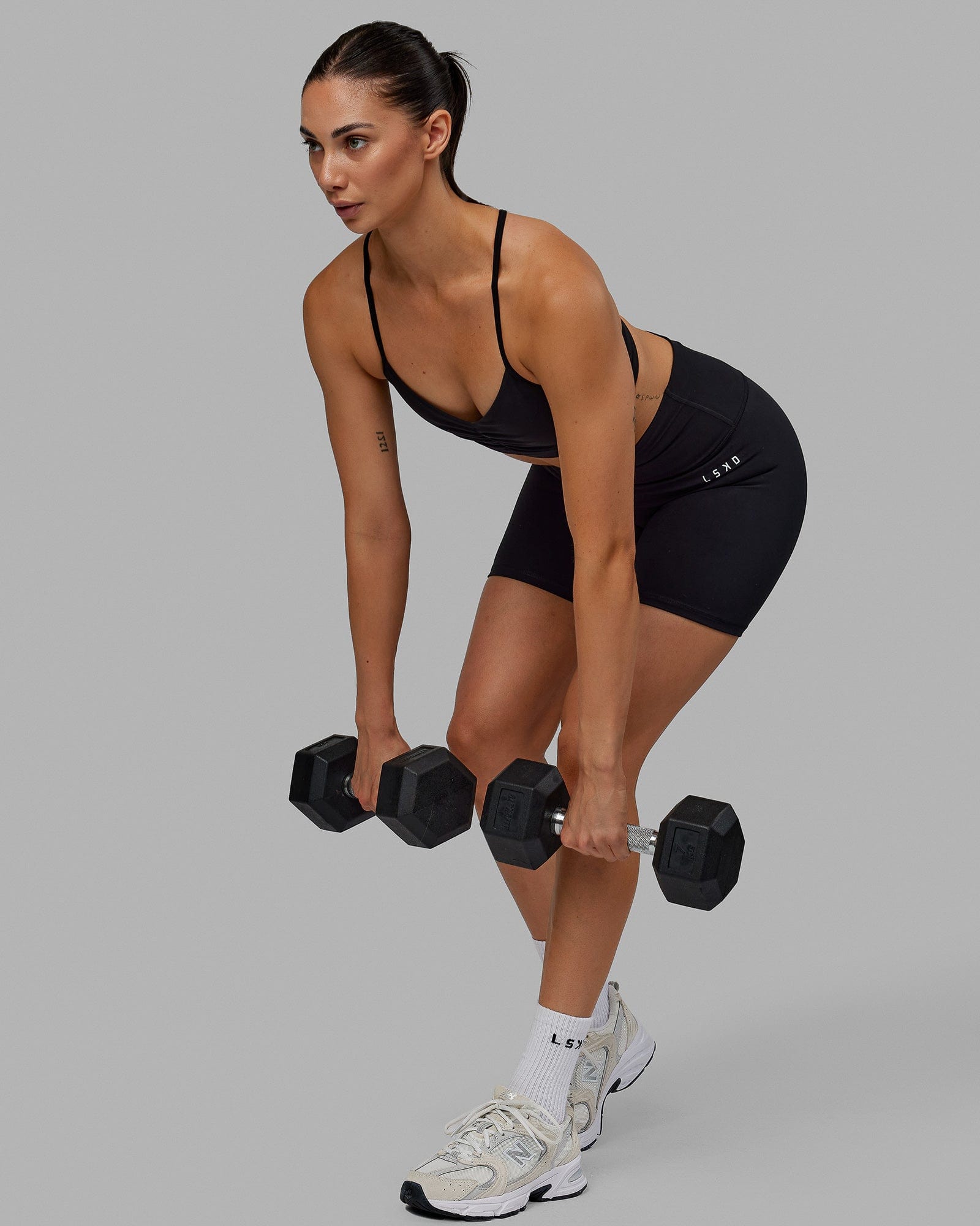 Woman wearing Base 2.0 Mid Short Tights - Black