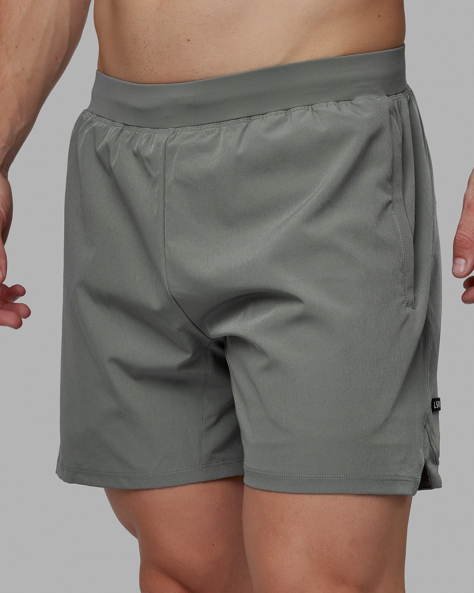Man wearing Challenger 6" Lined Performance Shorts - Graphite
