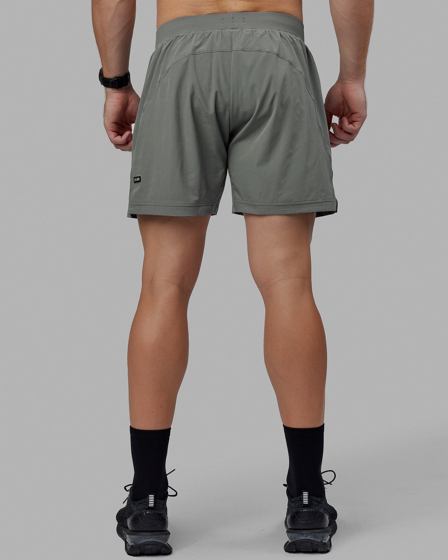 Man wearing Challenger 6" Performance Shorts - Graphite