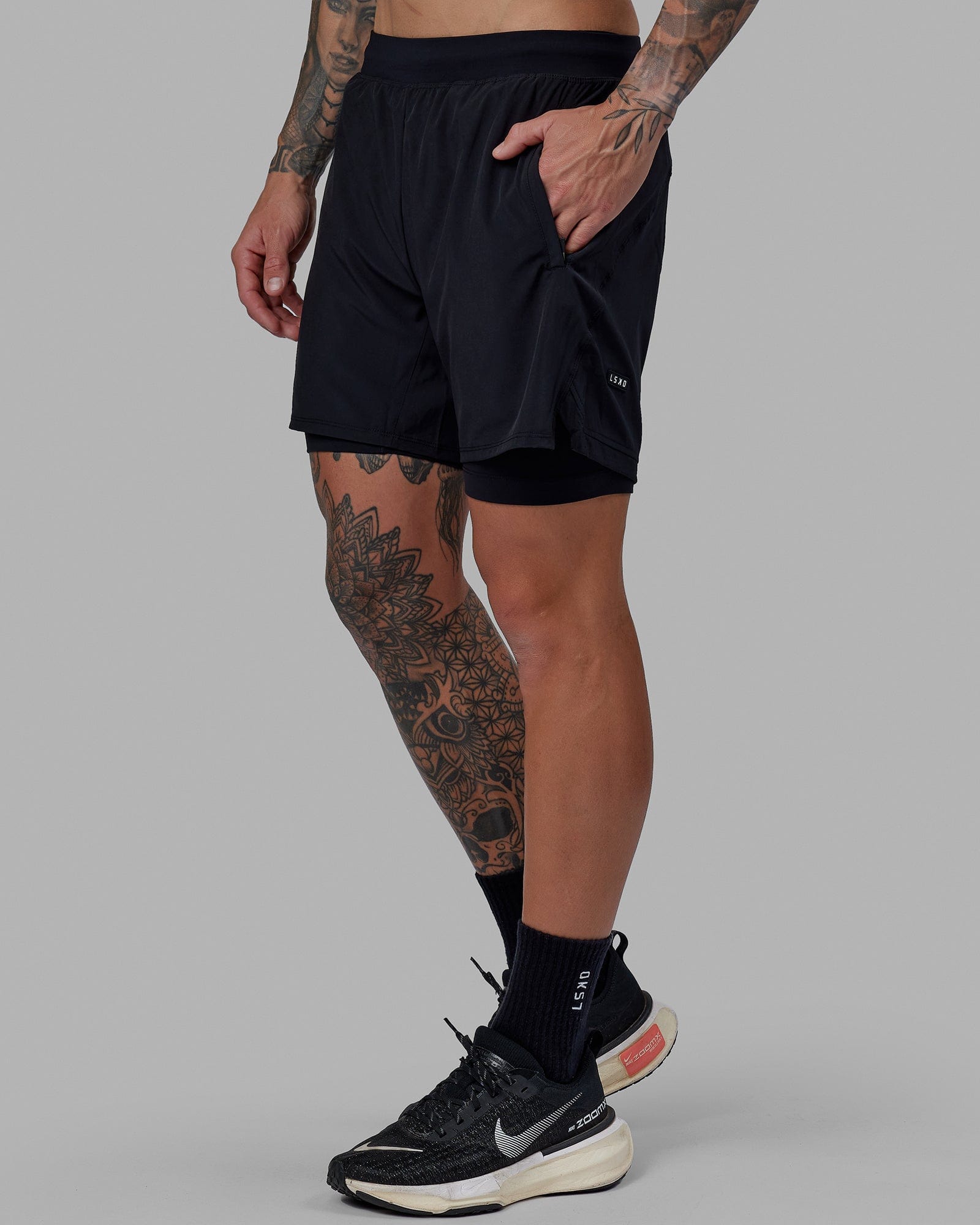 Man wearing Challenger 6" Lined Performance Short - Black
