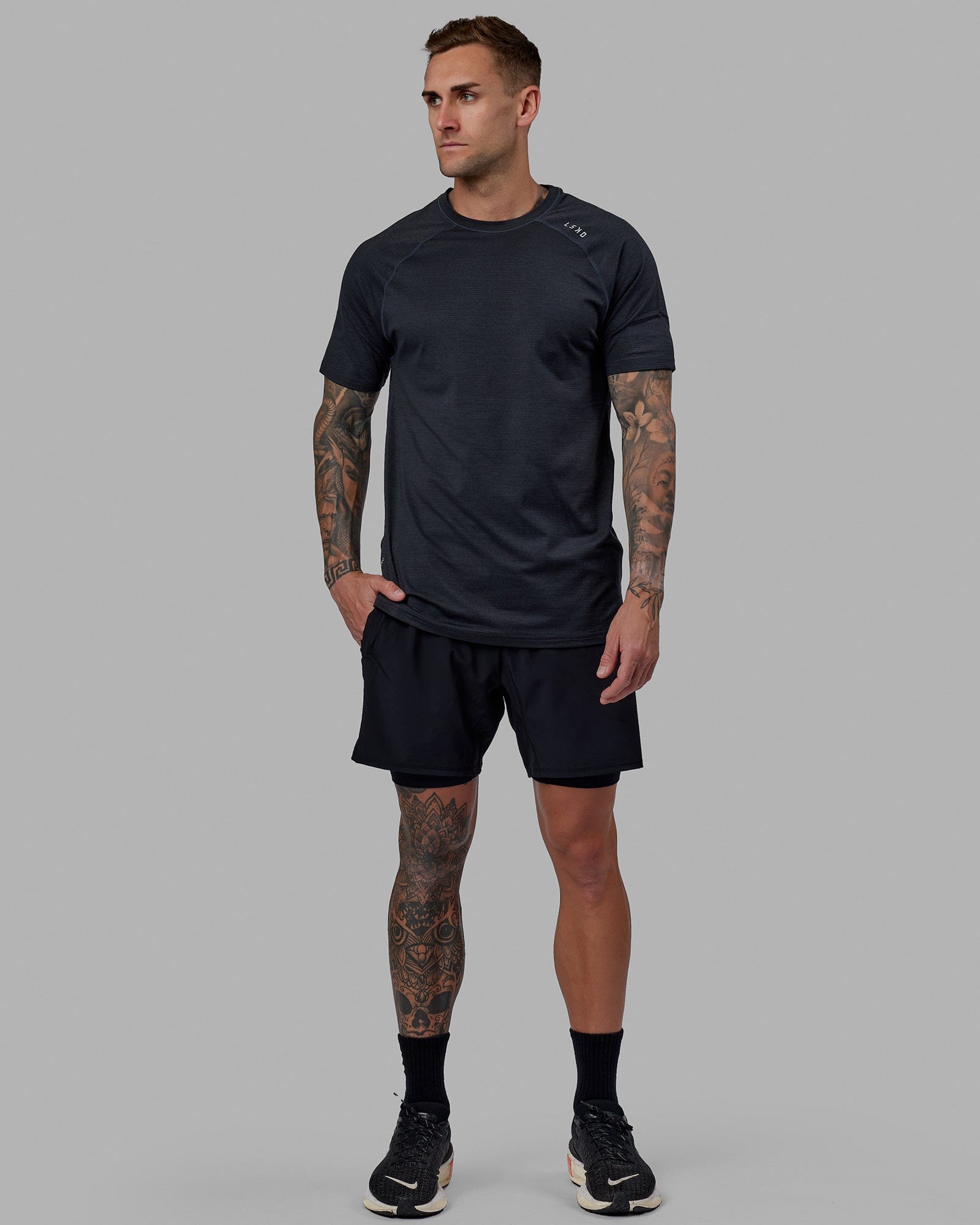Man wearing Challenger 6" Lined Performance Short - Black