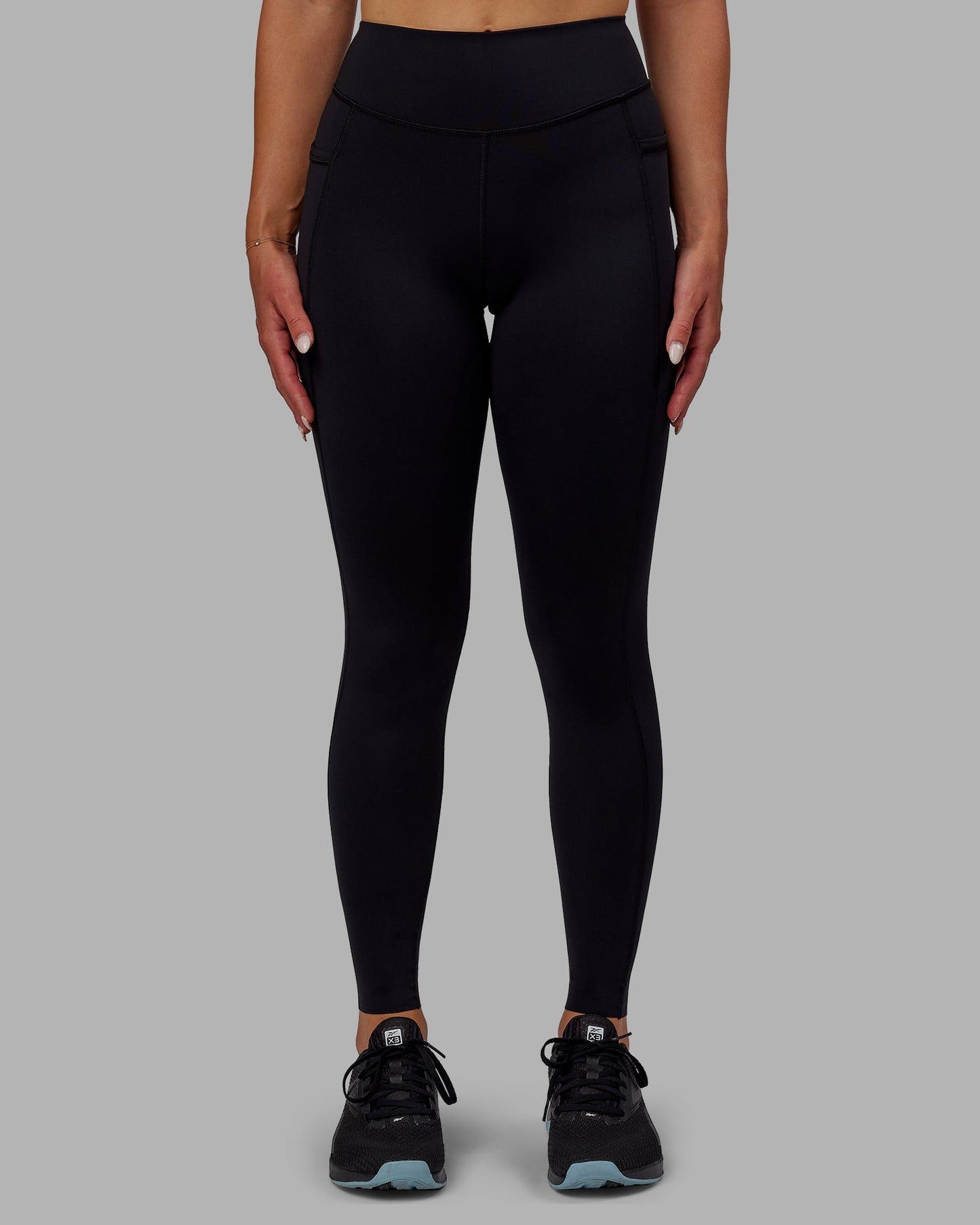 Woman wearing Elite Full Length Leggings - Black