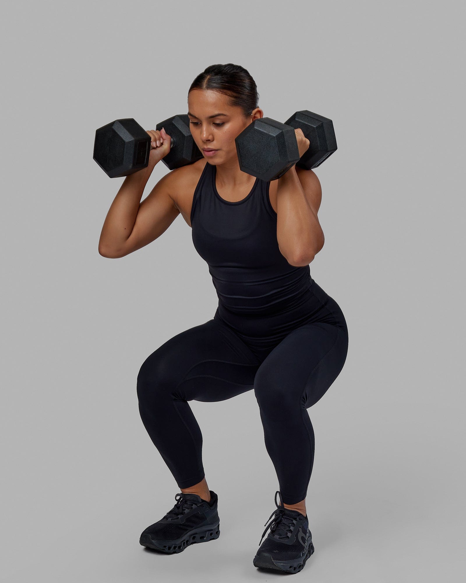 Woman wearing Flow Performance Tank - Black