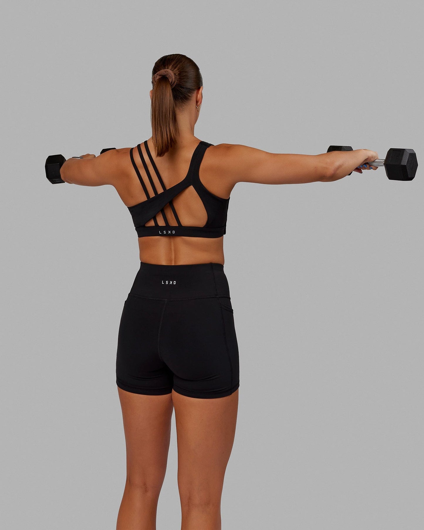 Woman wearing Galvanise Sports Bra - Black