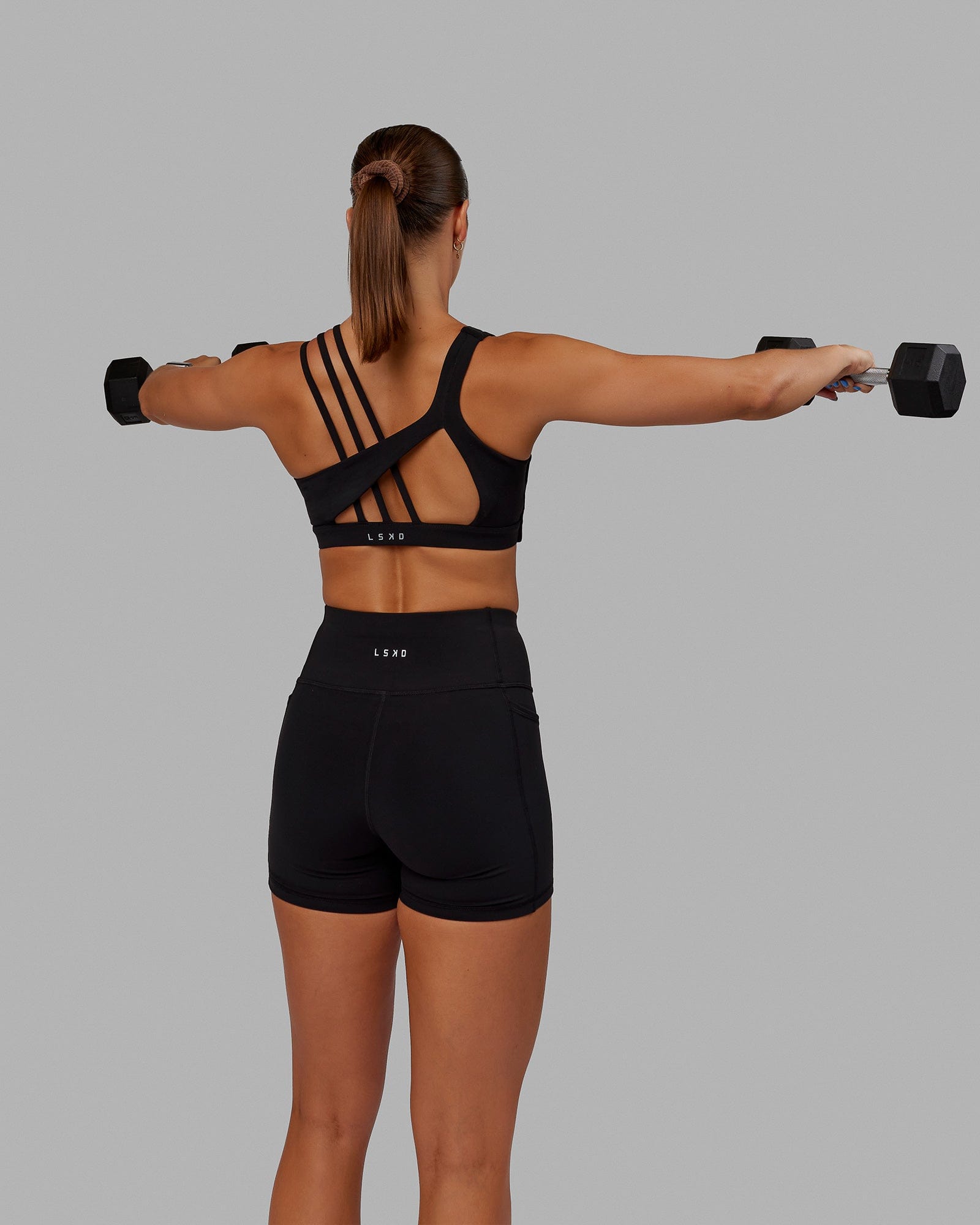 Woman wearing Galvanise Sports Bra - Black