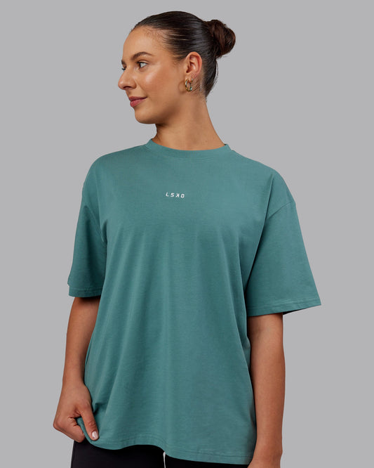 Woman wearing Go-To FLXCotton Oversized Tee - Sage Bush-White