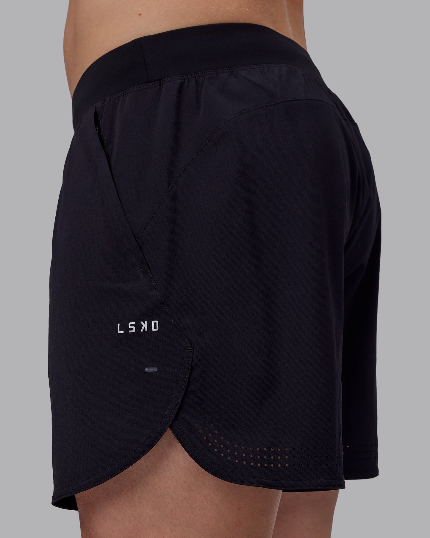 Man wearing Lift 6" Performance Shorts - Black-Reflective
