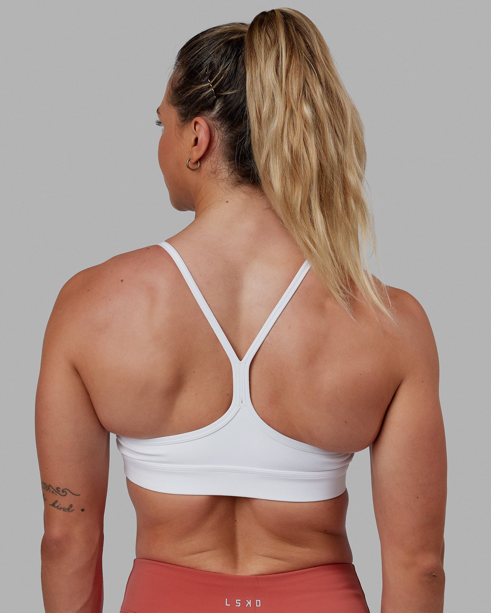 Woman wearing Lift Sports Bra - White