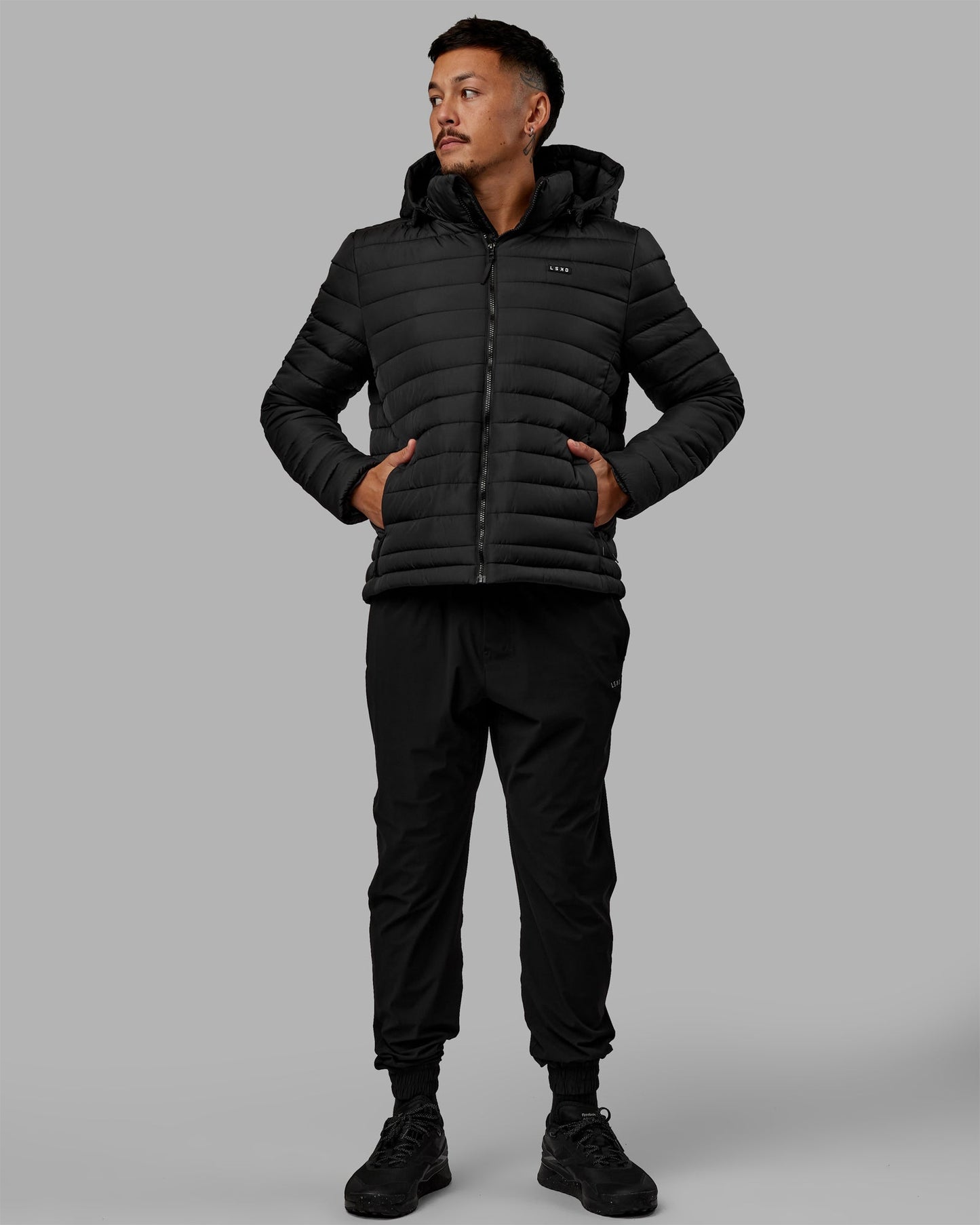 Man wearing All-day Puffer Jacket - Black