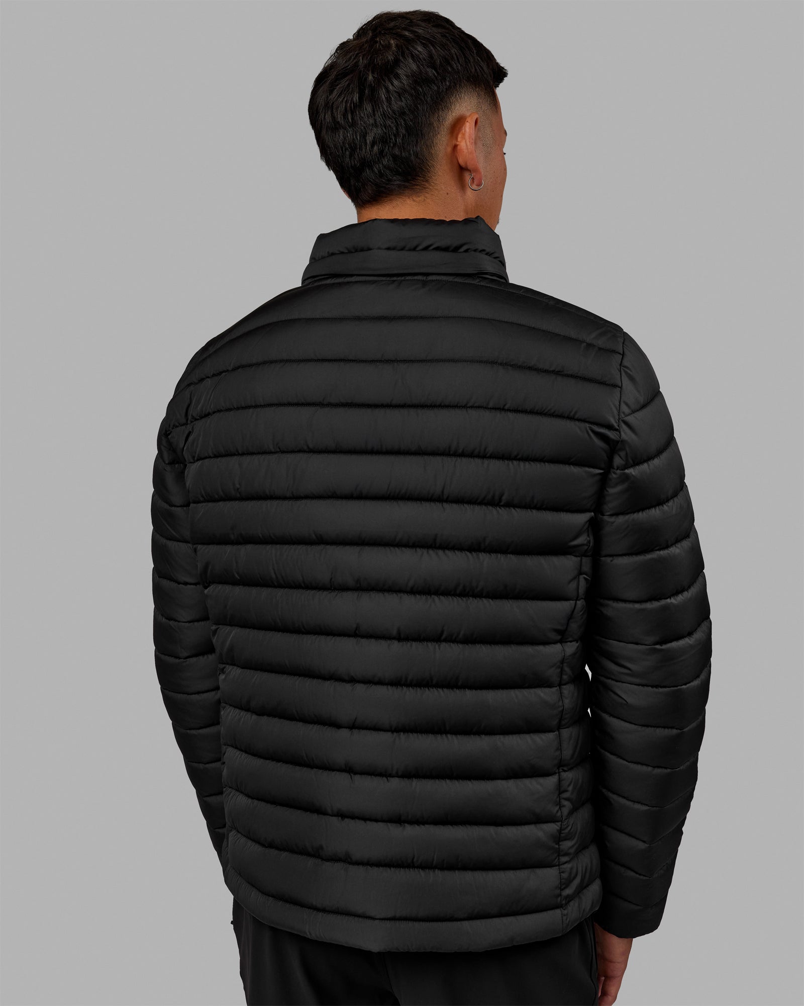Man wearing All-day Puffer Jacket - Black