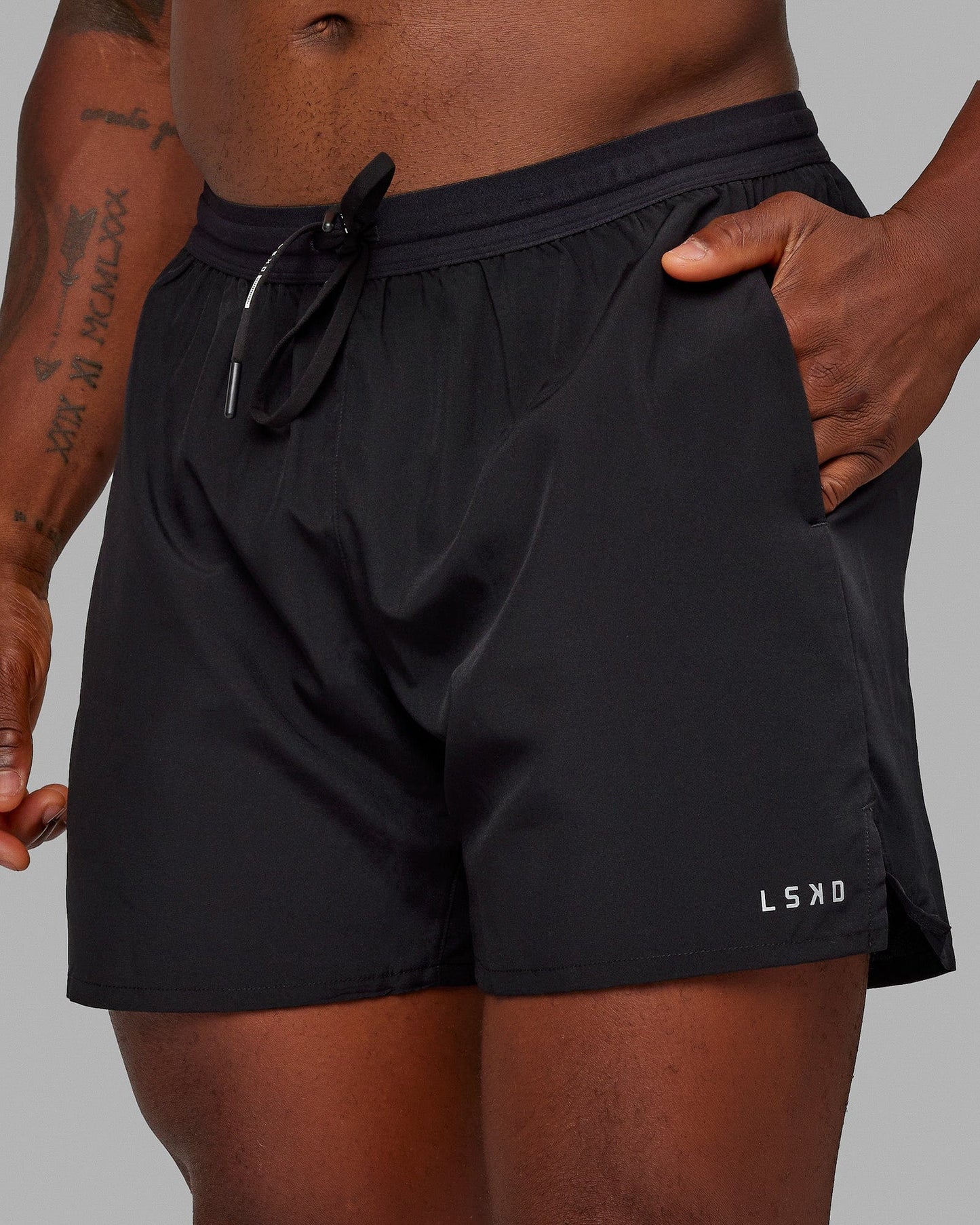 Man wearing Pace 5" Lined Performance Shorts - Black-Reflective