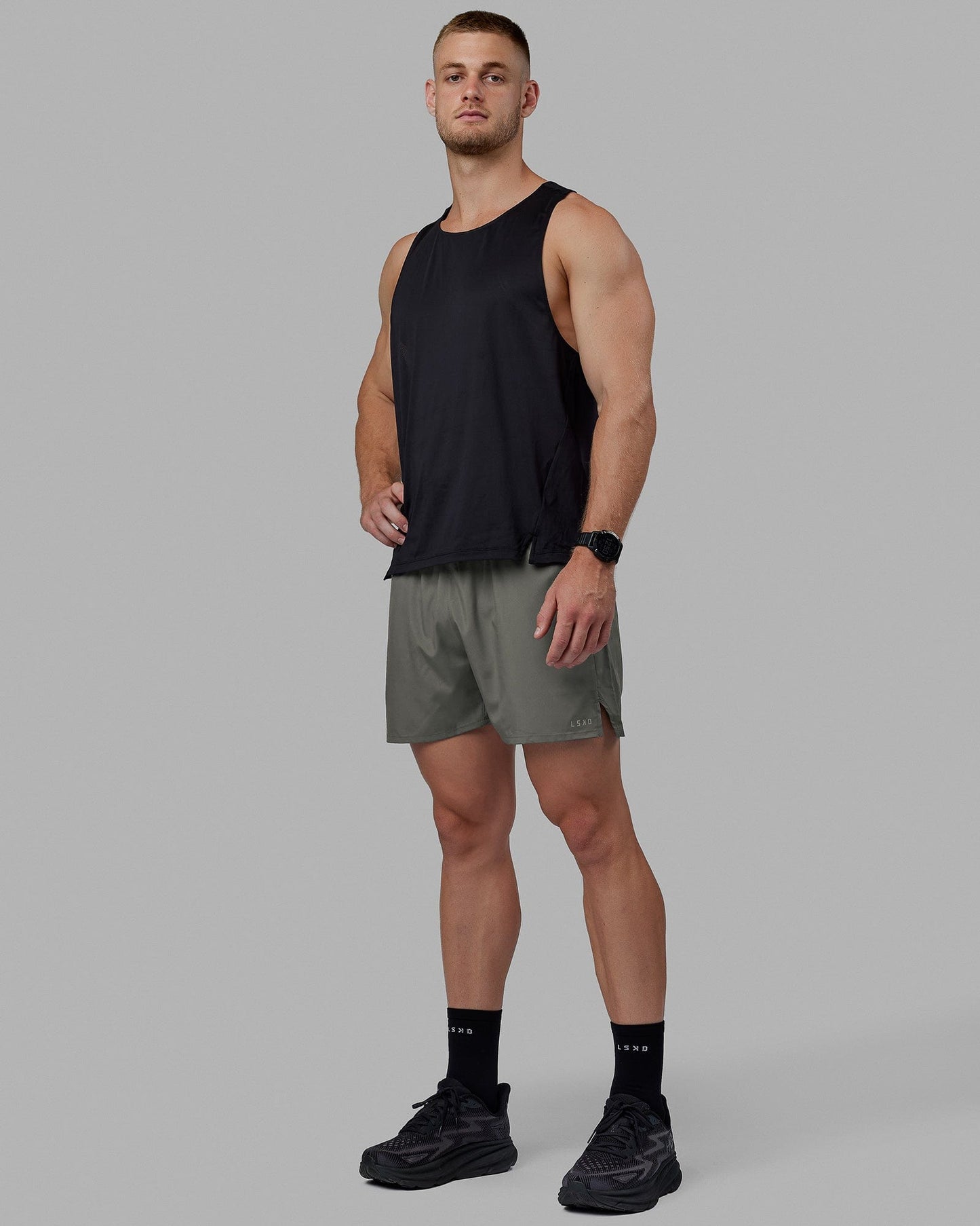 Man wearing Pace 5" Lined Performance Shorts - Graphite-Reflective