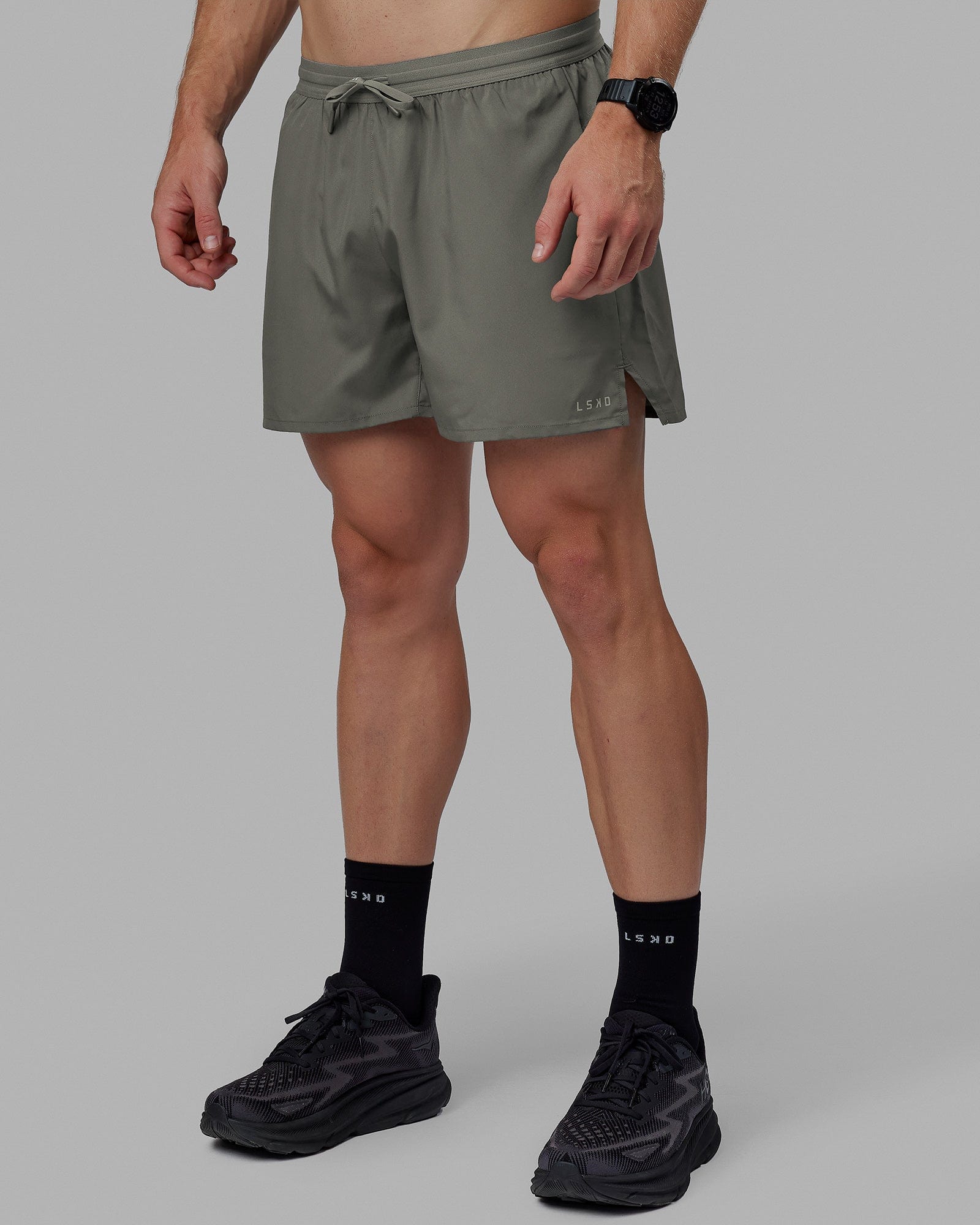 Man wearing Pace 5" Lined Performance Shorts - Graphite-Reflective