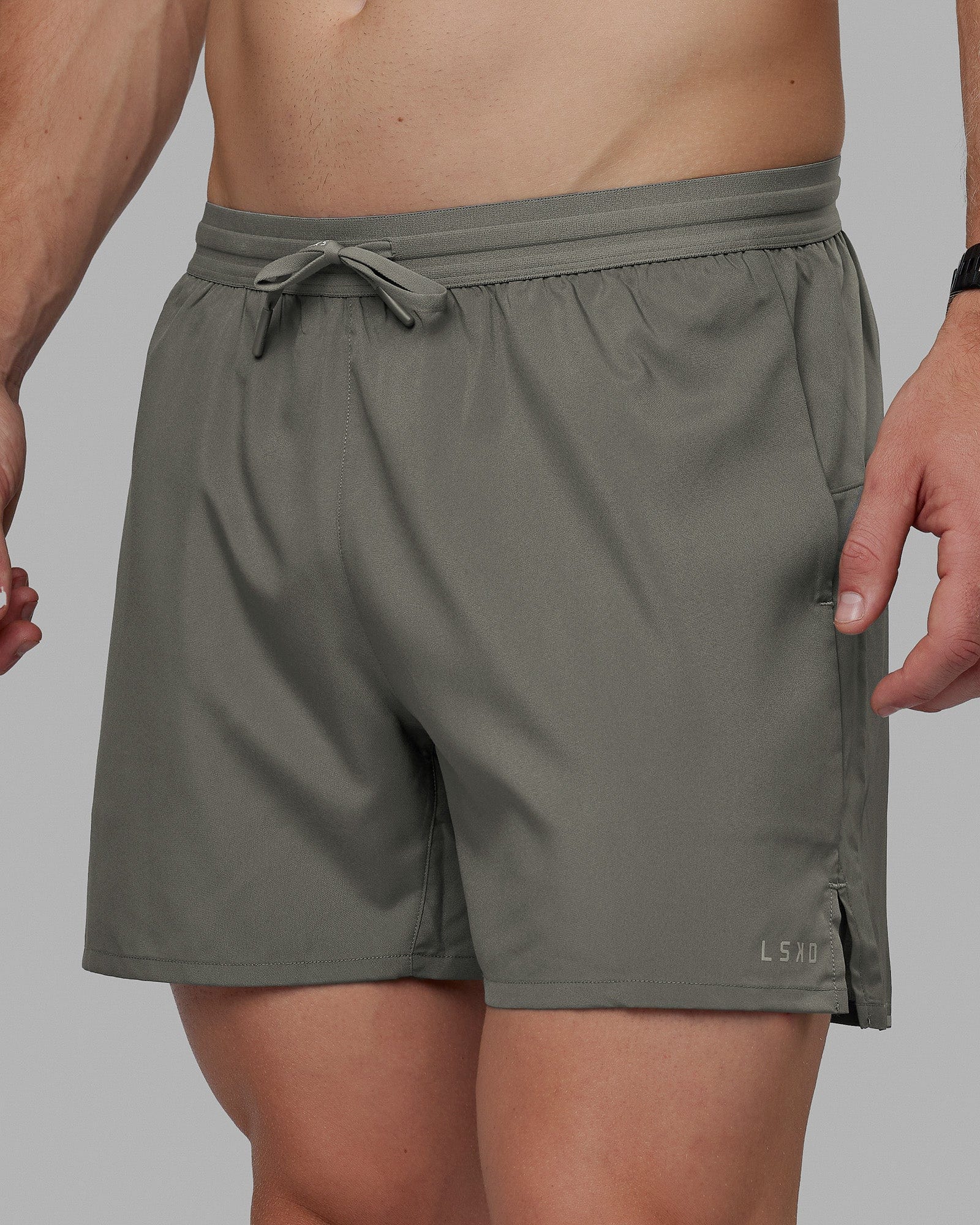 Man wearing Pace 5" Lined Performance Shorts - Graphite-Reflective
