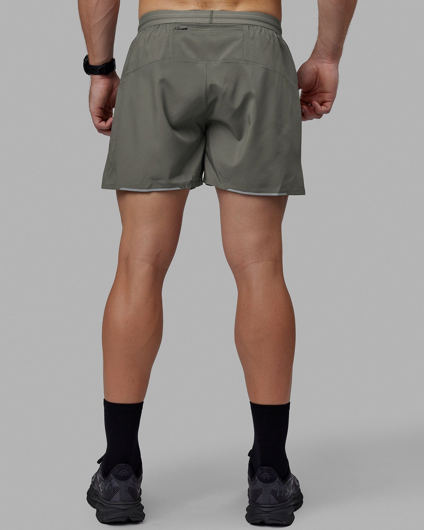 Man wearing Pace 5" Lined Performance Shorts - Graphite-Reflective