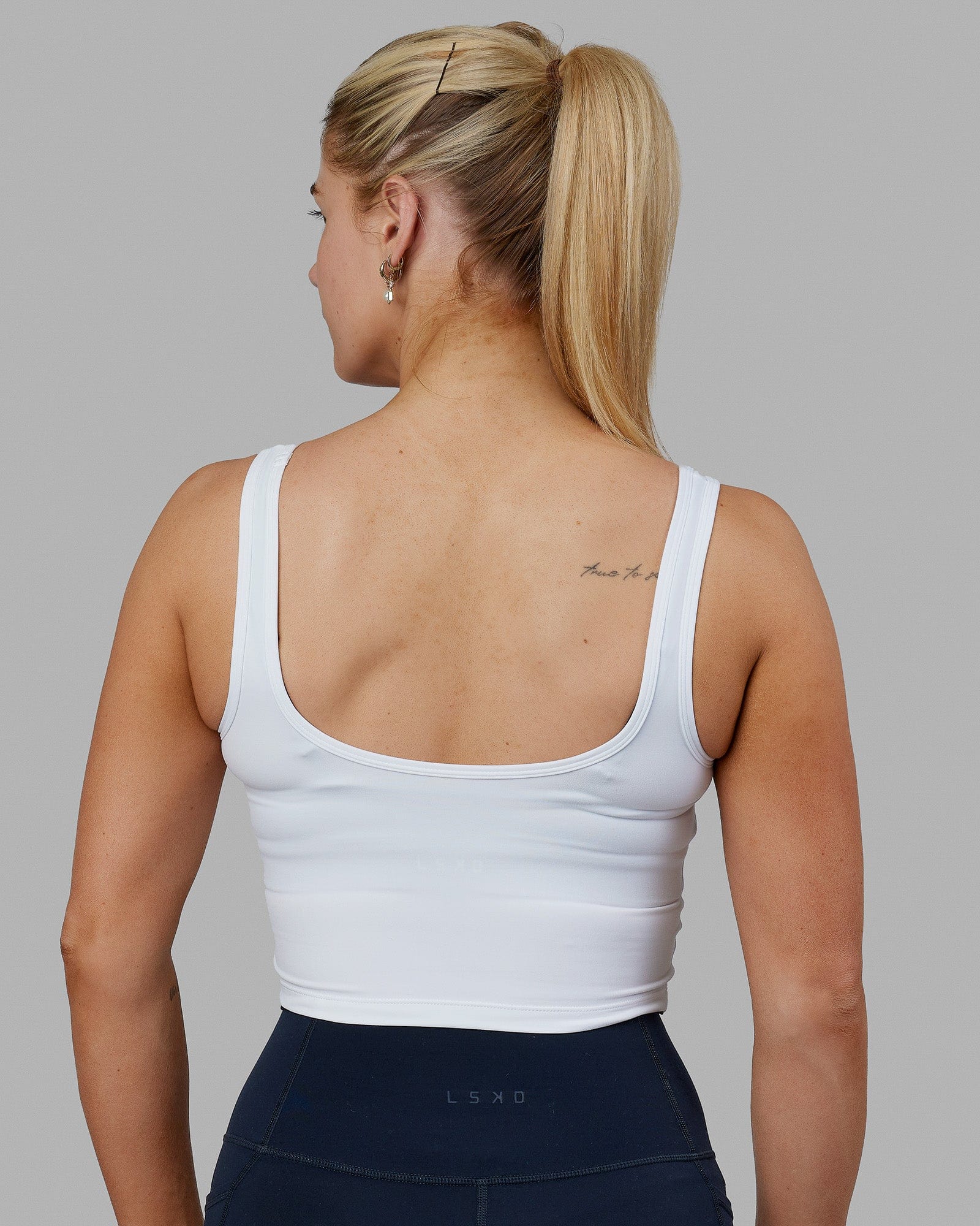 Woman wearing Staple Active Cropped Tank - White