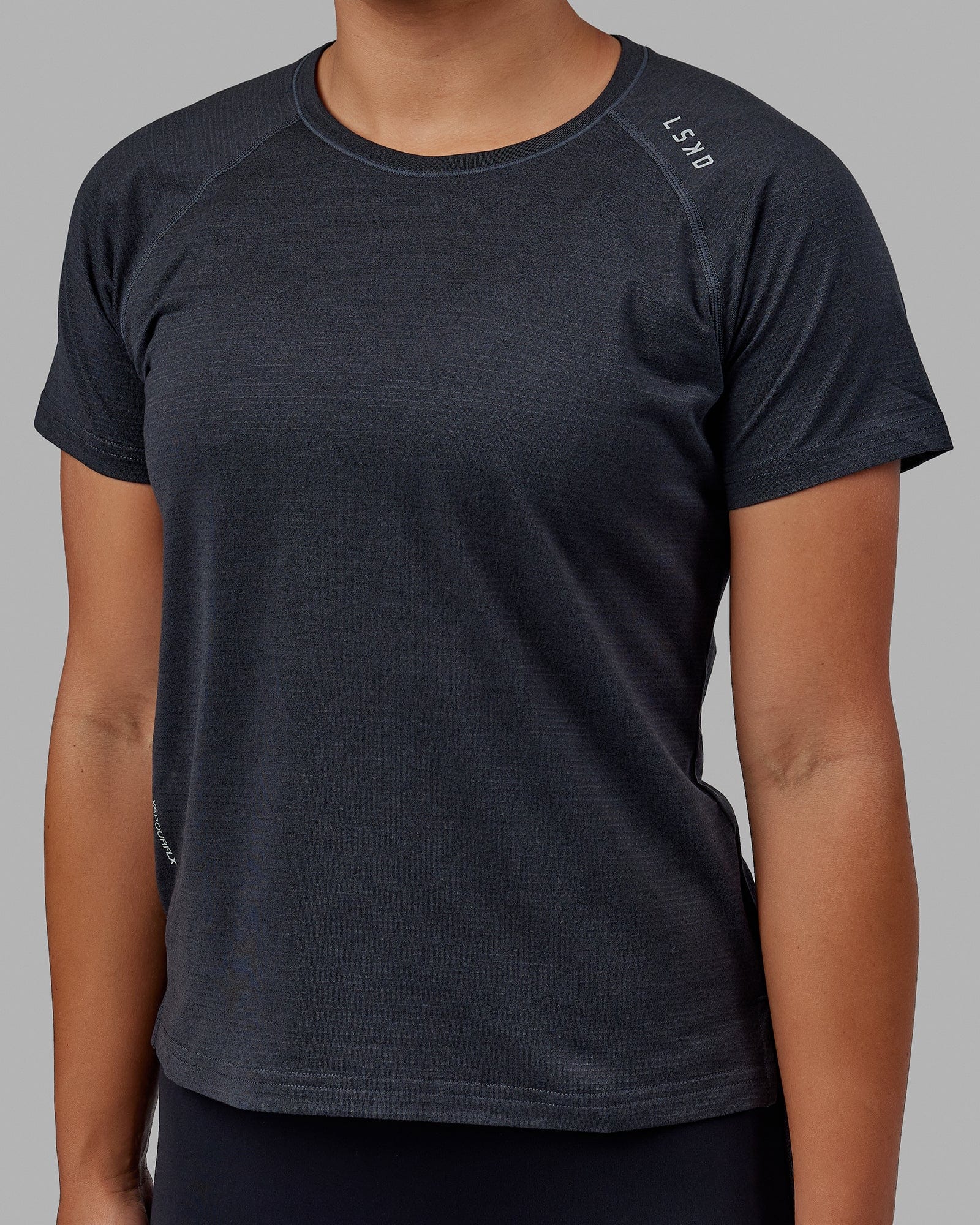 Woman wearing Perform VapourFLX Tee - Black Marl