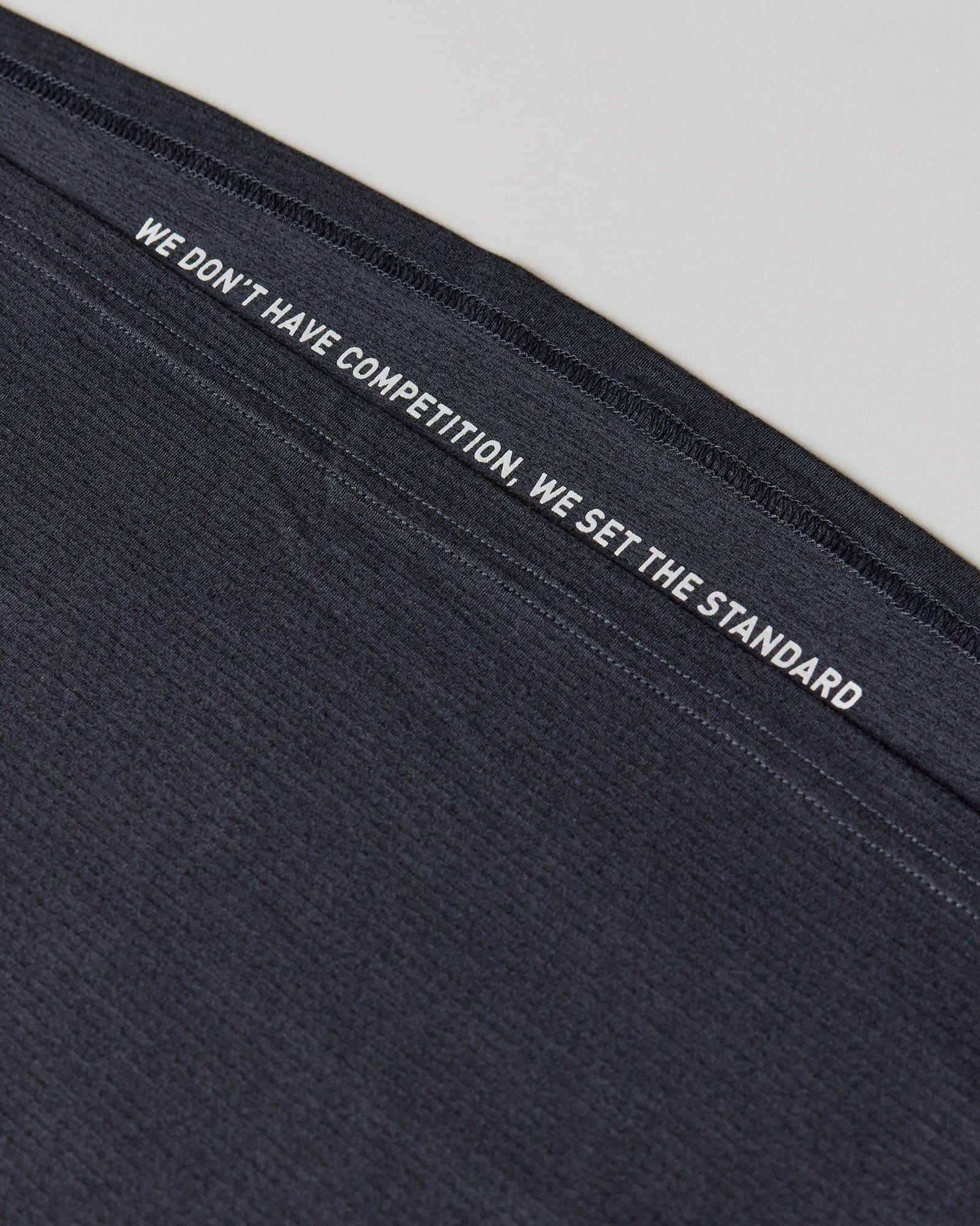 Woman wearing Perform VapourFLX Tee - Black Marl