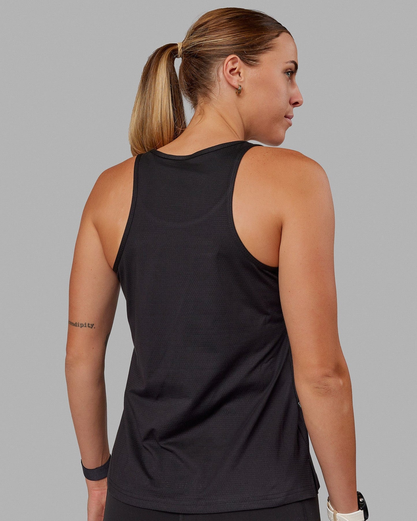 Woman wearing Perform VapourFLX Tank - Black