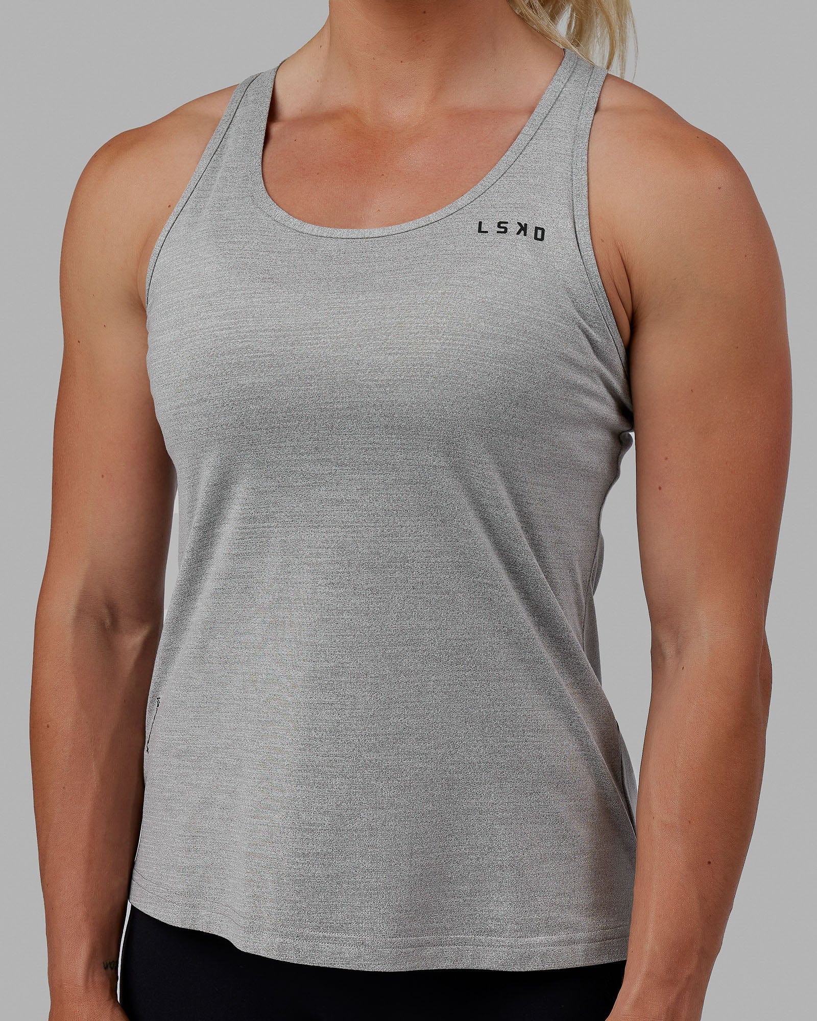 Woman wearing Perform VapourFLX Tank - Lt Grey Marl