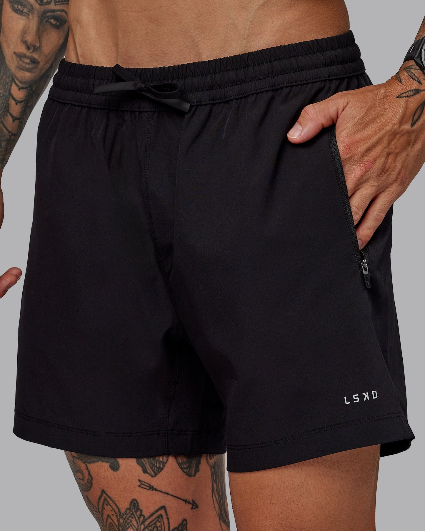 Man wearing Rep 5" Lined Performance Shorts in Black | Size:S