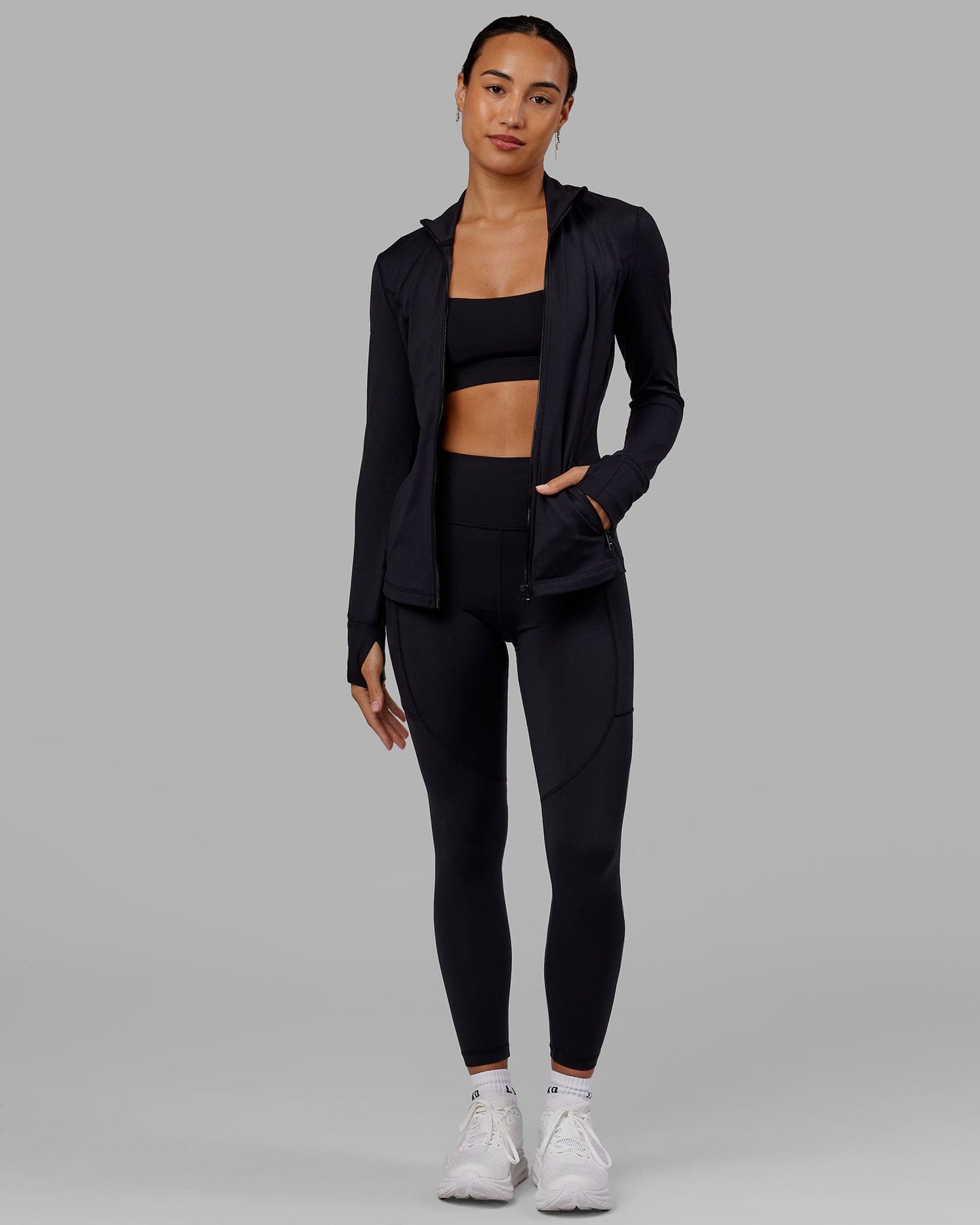 Woman wearing Stride Zip Through Jacket - Black