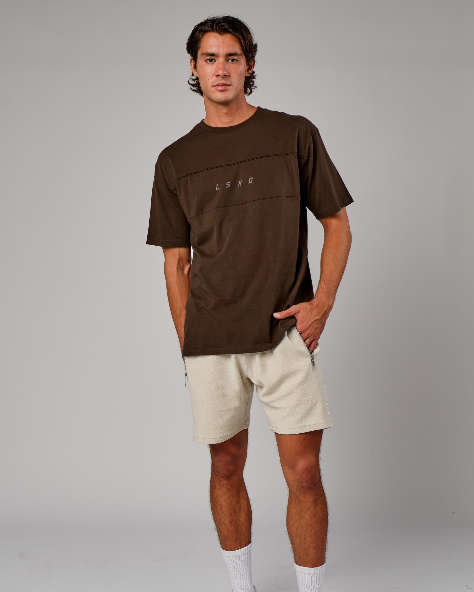 Model wearing Ascent Tee Oversize - Walnut