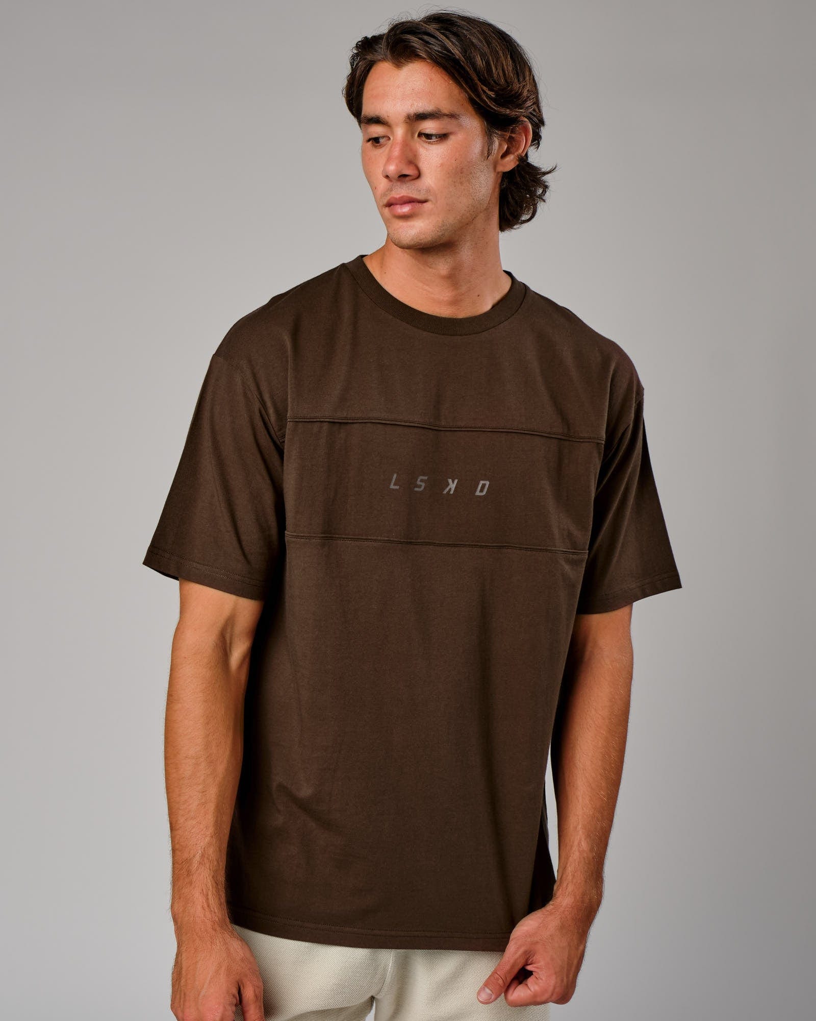 Model wearing Ascent Tee Oversize - Walnut