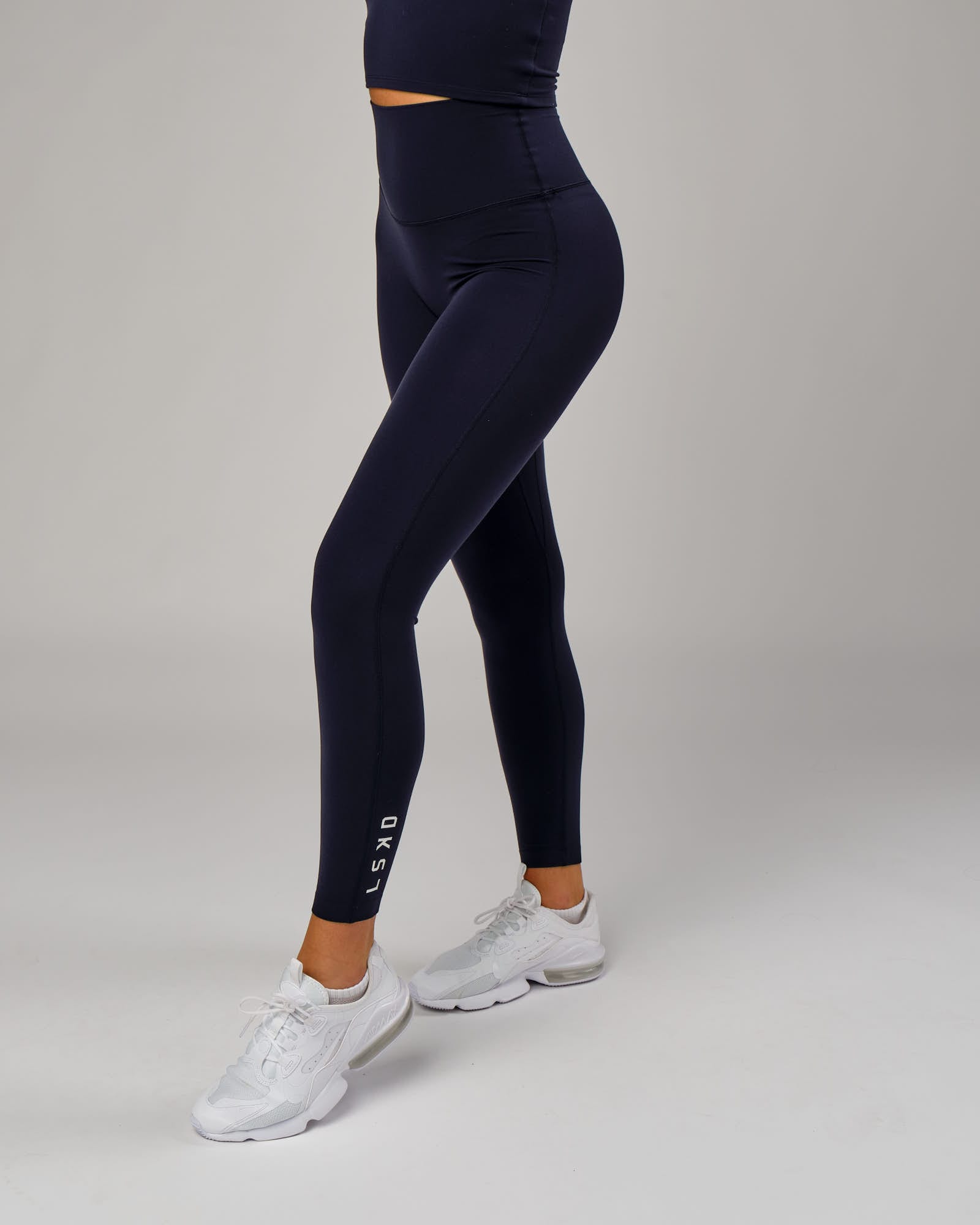 Model wearing Elixir Full Length Tight - Navy
