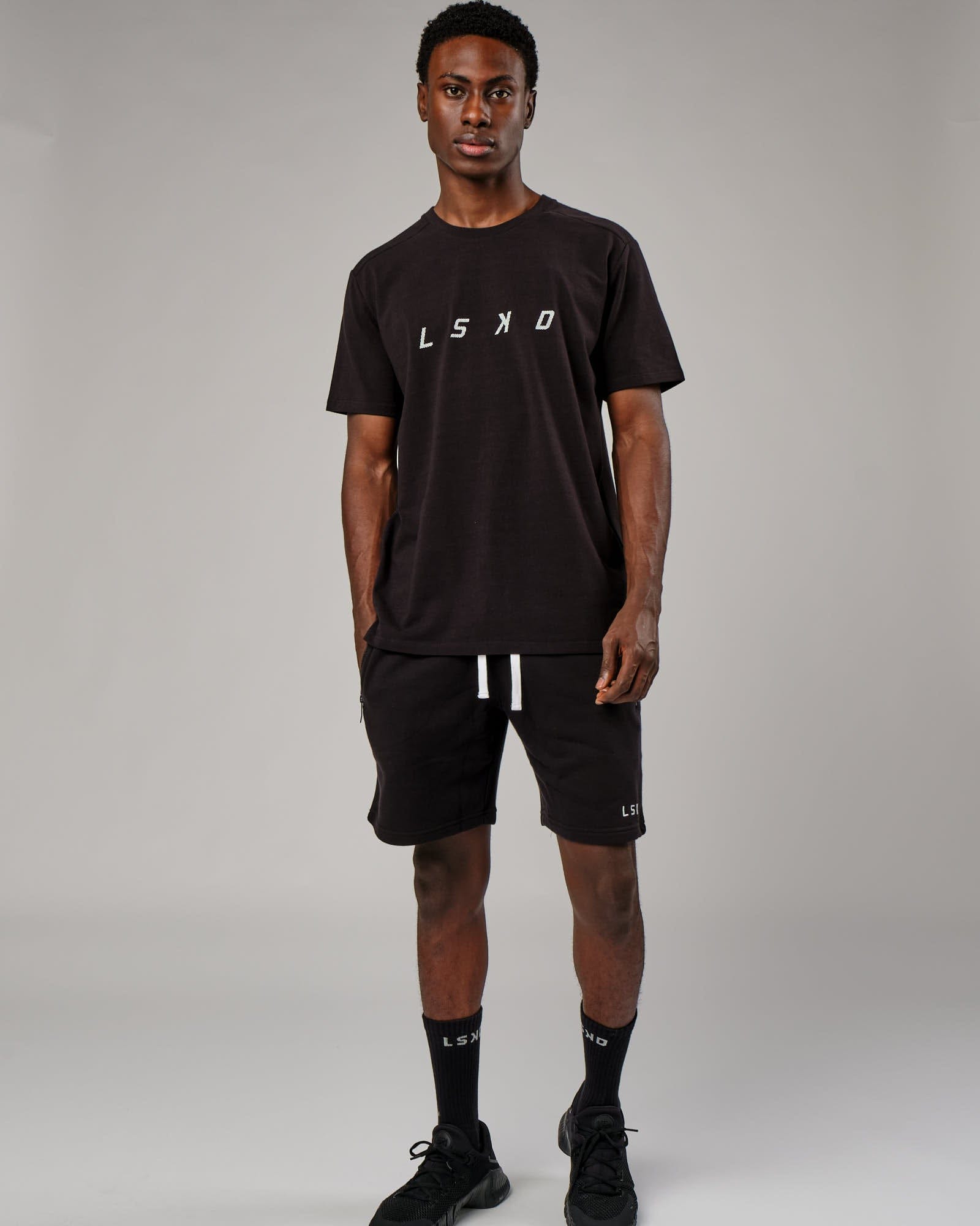 Model wearing Grid Tee - Black