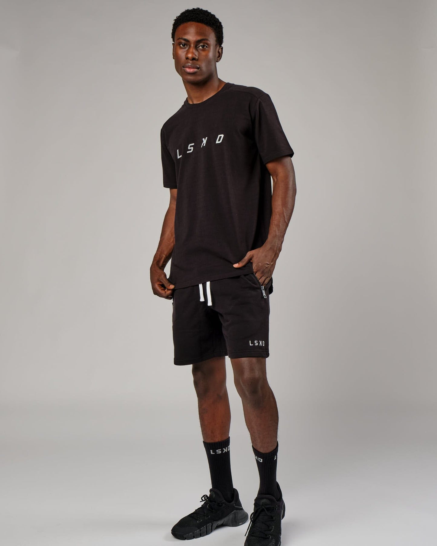 Model wearing Grid Tee - Black