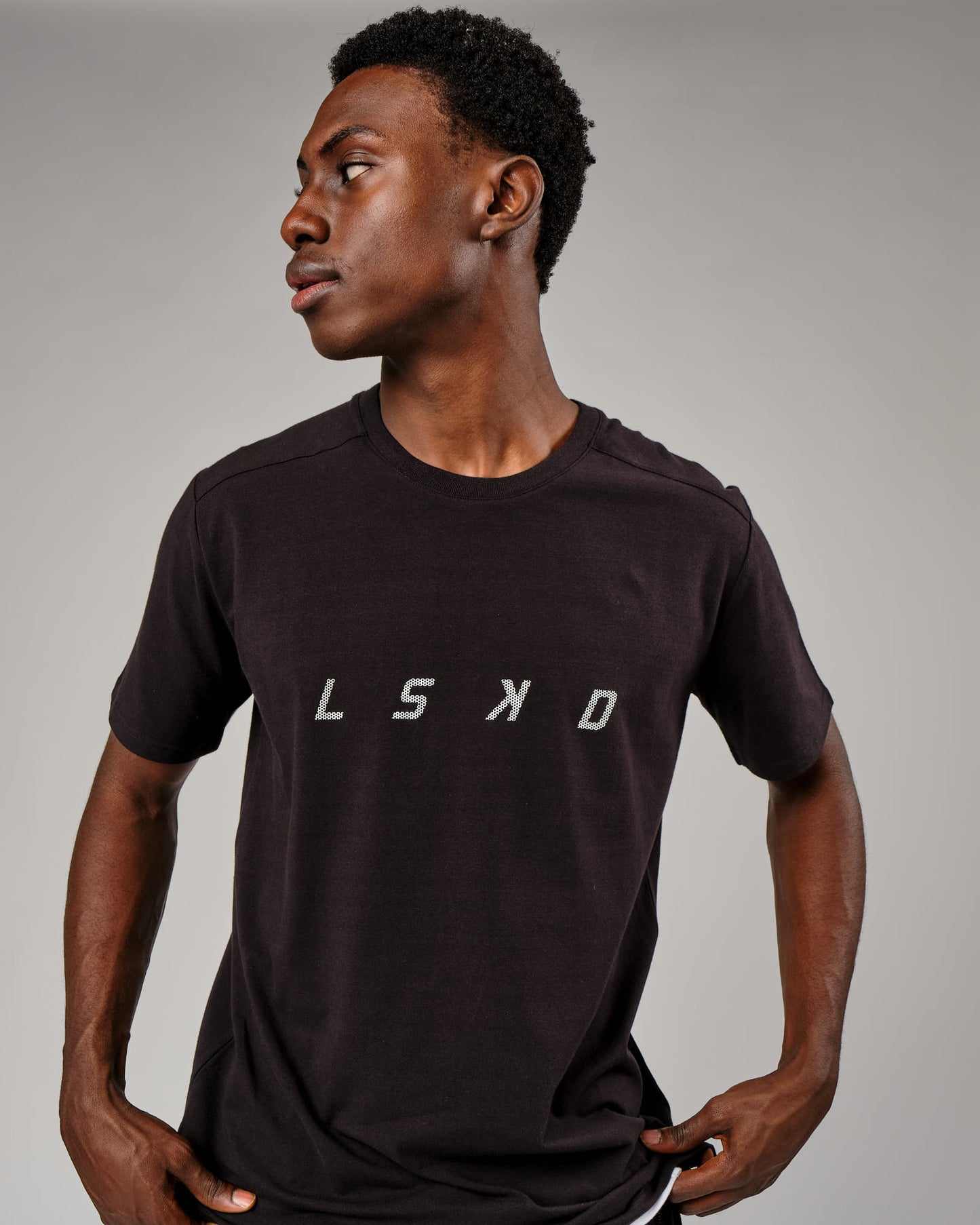 Model wearing Grid Tee - Black