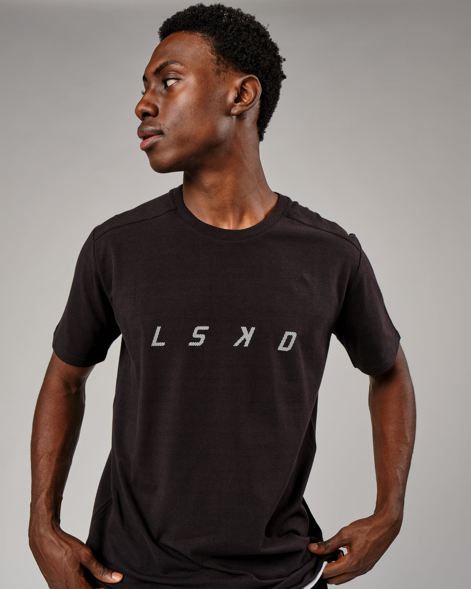 Model wearing Grid Tee - Black
