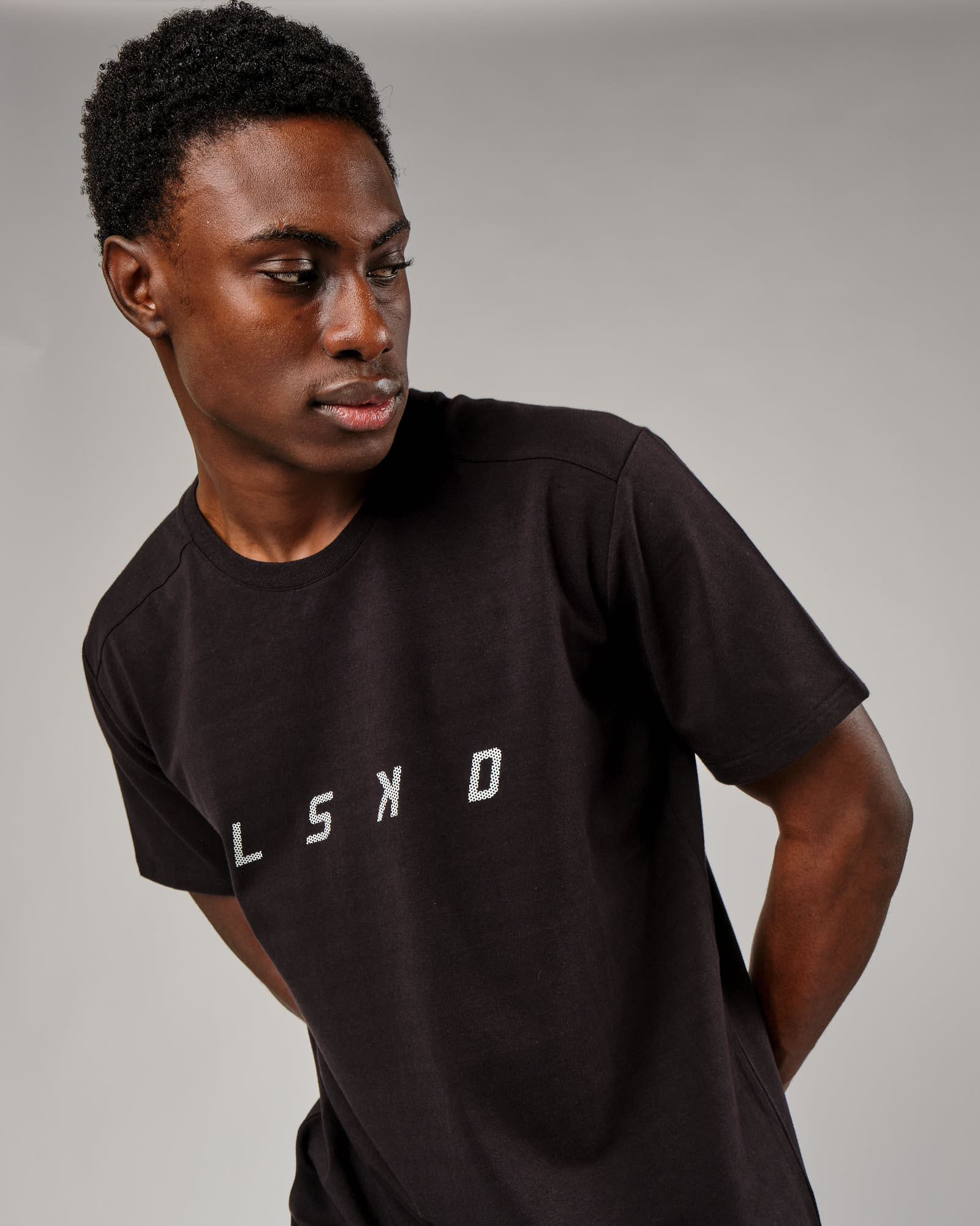 Model wearing Grid Tee - Black