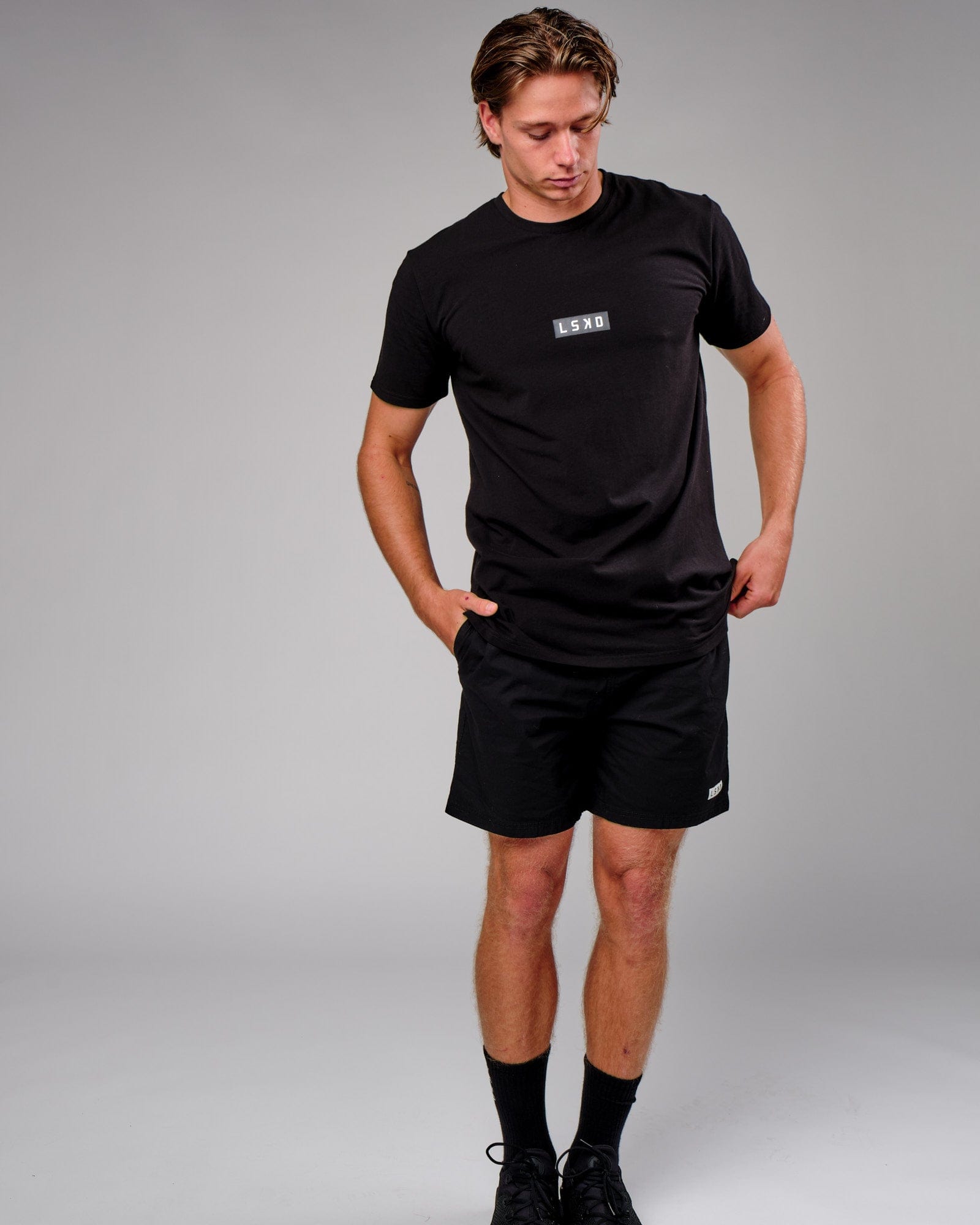 Model wearing Velocity Tee - Black