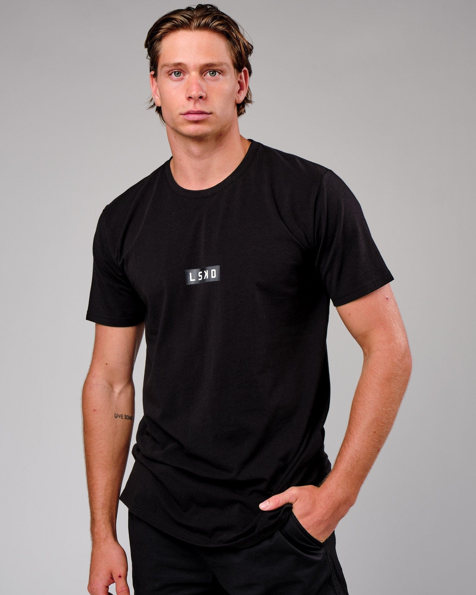 Model wearing Velocity Tee - Black