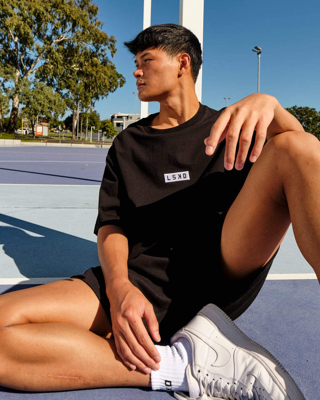 Model wearing Cornerstone Tee Oversize - Black