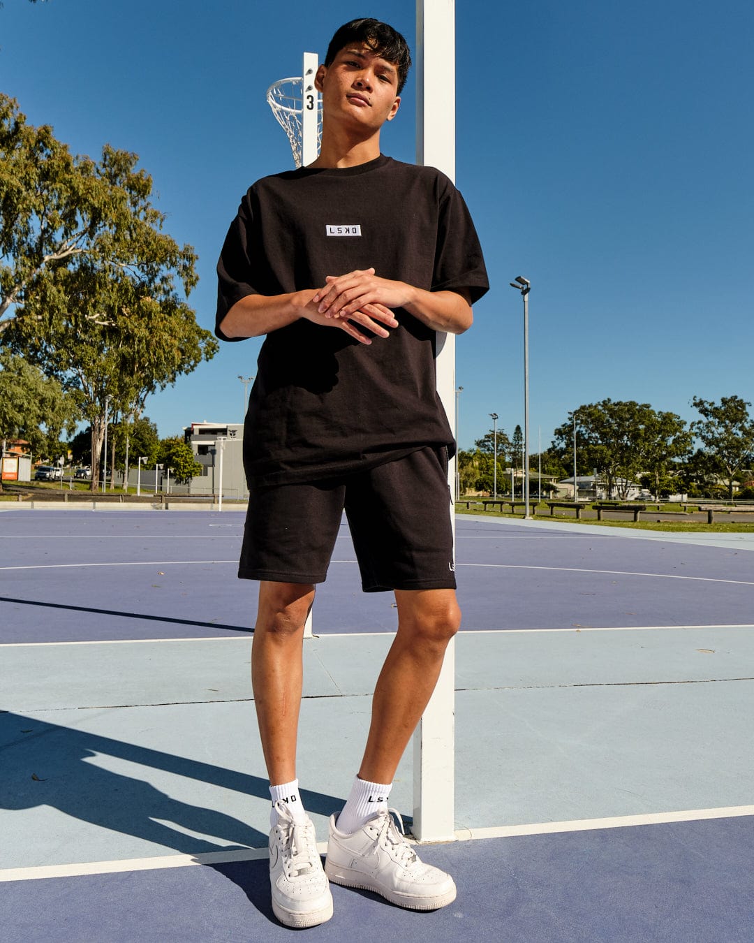 Model wearing Cornerstone Tee Oversize - Black