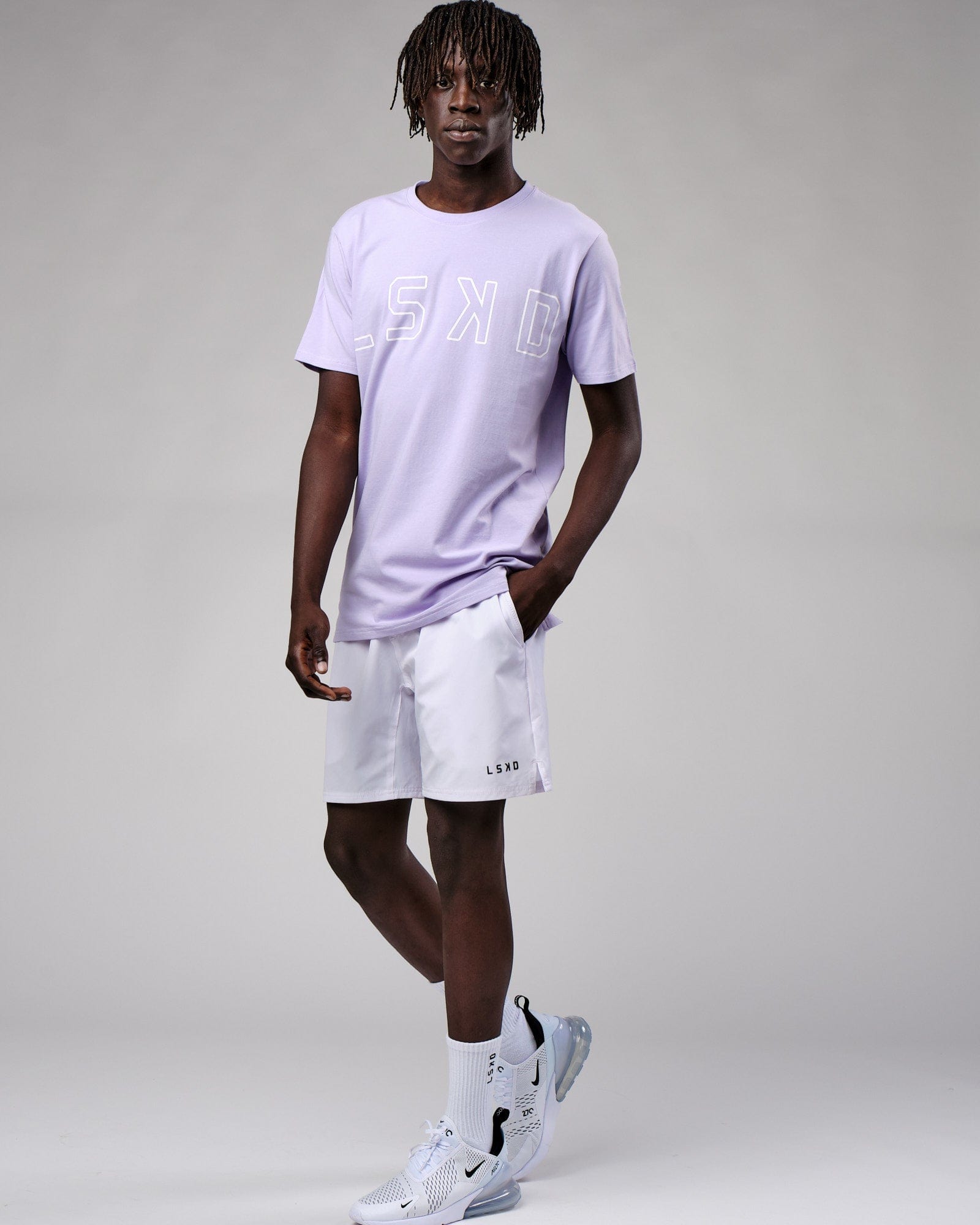 Model wearing Expand FLXCotton Tee - Cosmic Sky