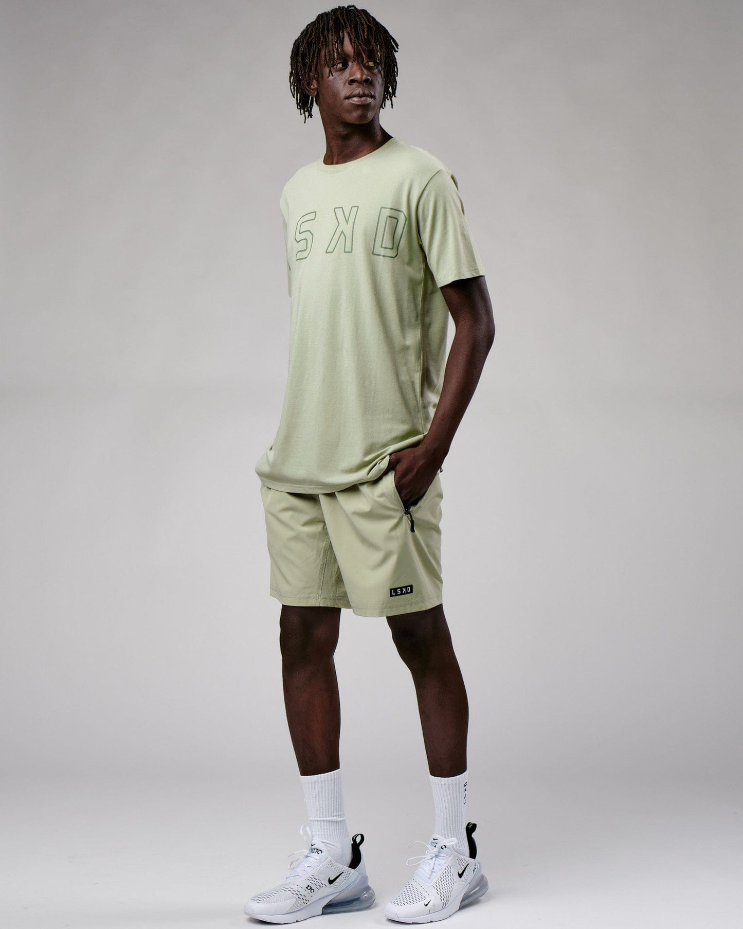 Model wearing Expand FLXCotton Tee - Desert Sage