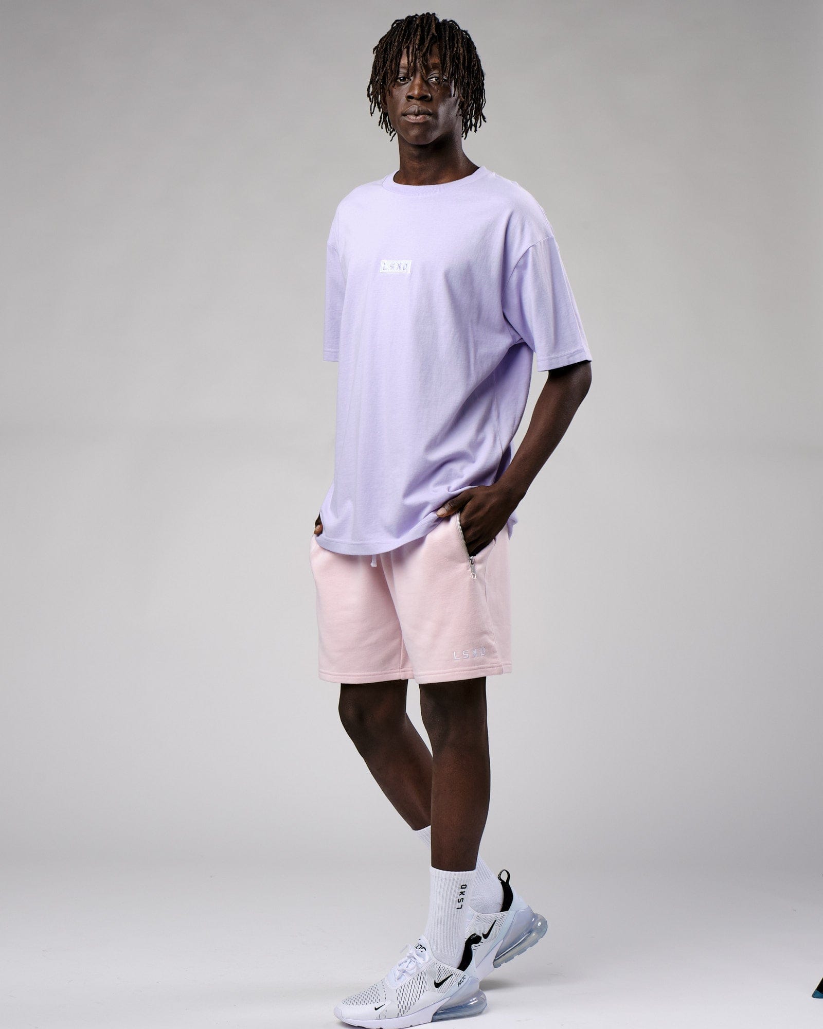 Model wearing Cornerstone Tee Oversize - Cosmic Sky