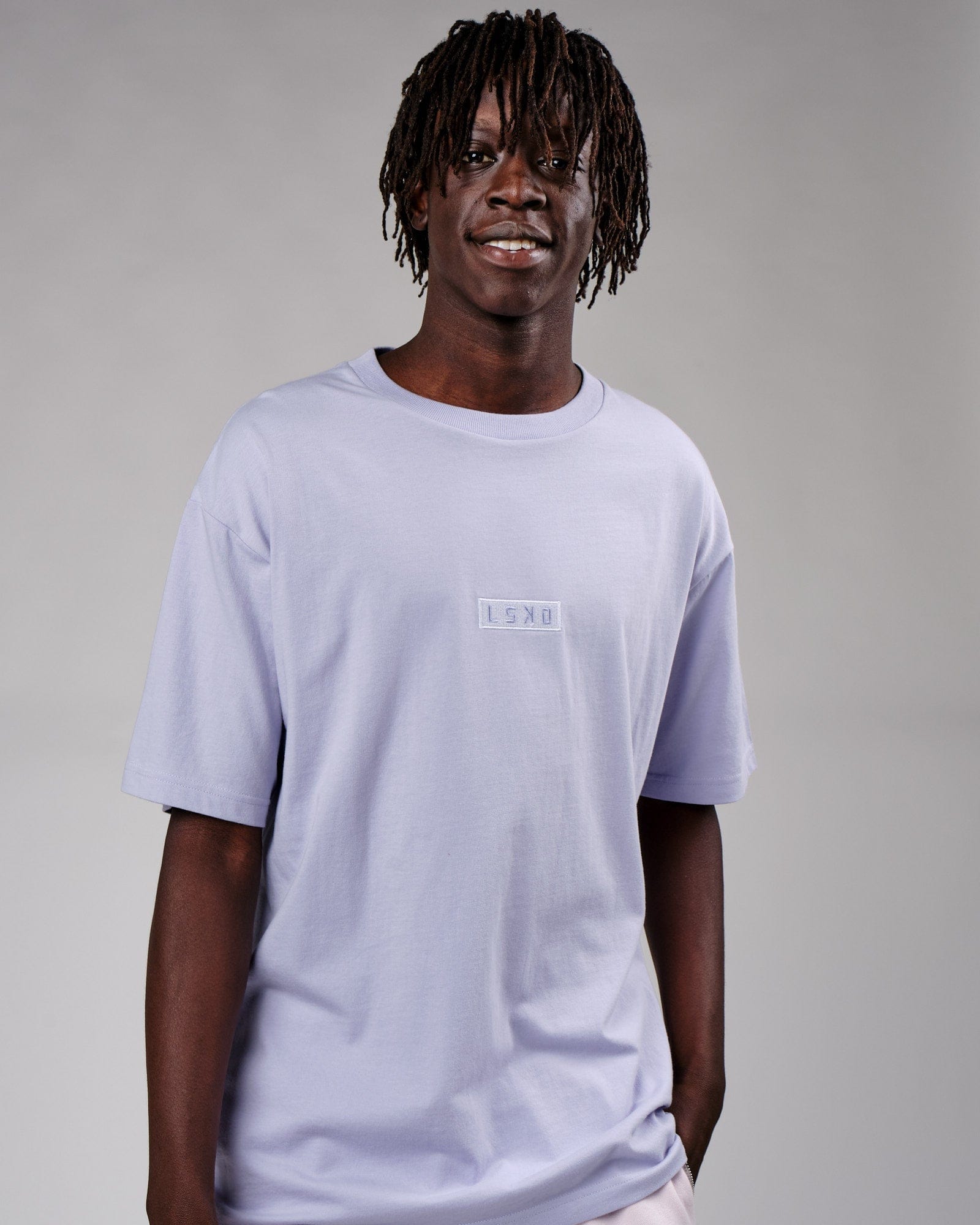 Model wearing Cornerstone Tee Oversize - Cosmic Sky