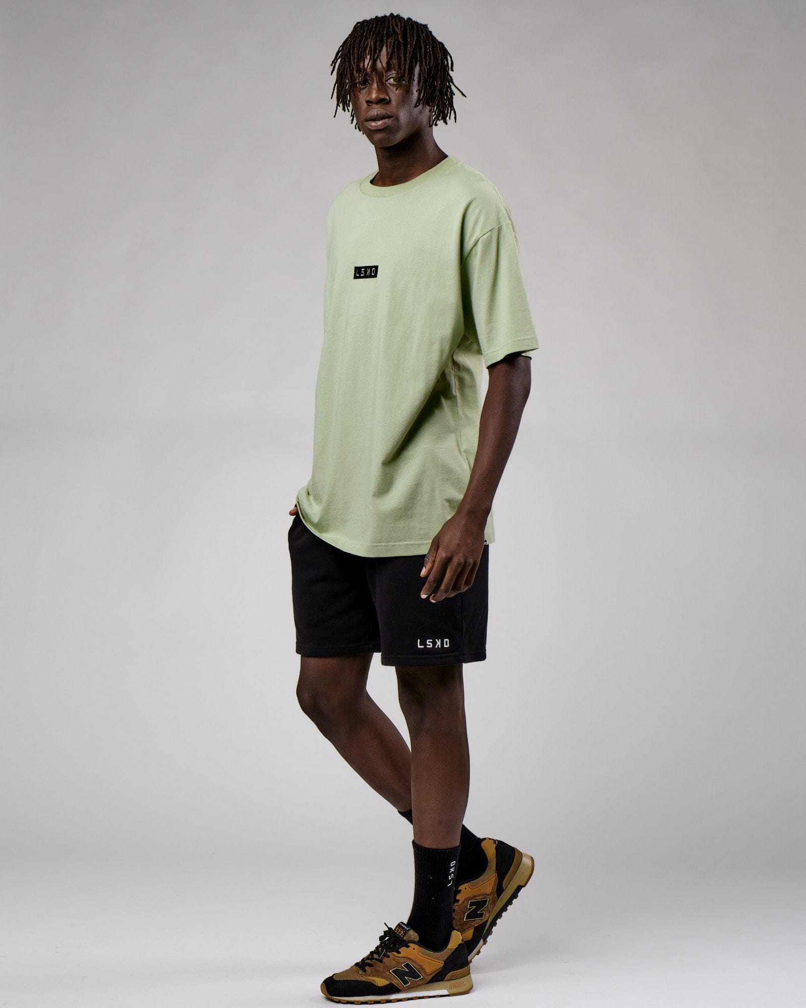 Model wearing Cornerstone Tee Oversize - Desert Sage