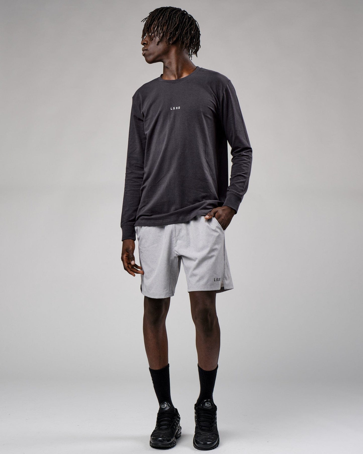 Model wearing Base LS Tee - Phantom