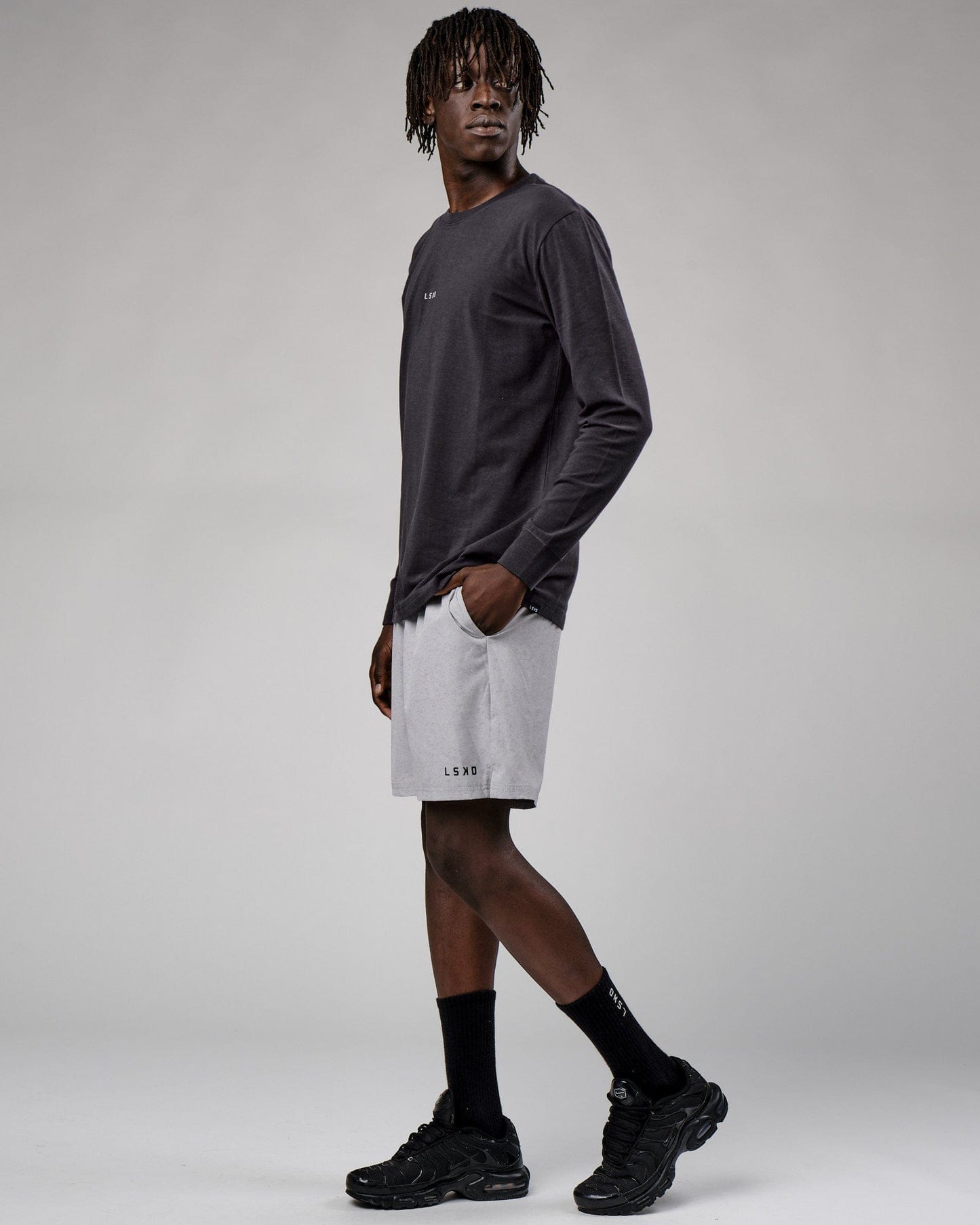 Model wearing Base LS Tee - Phantom